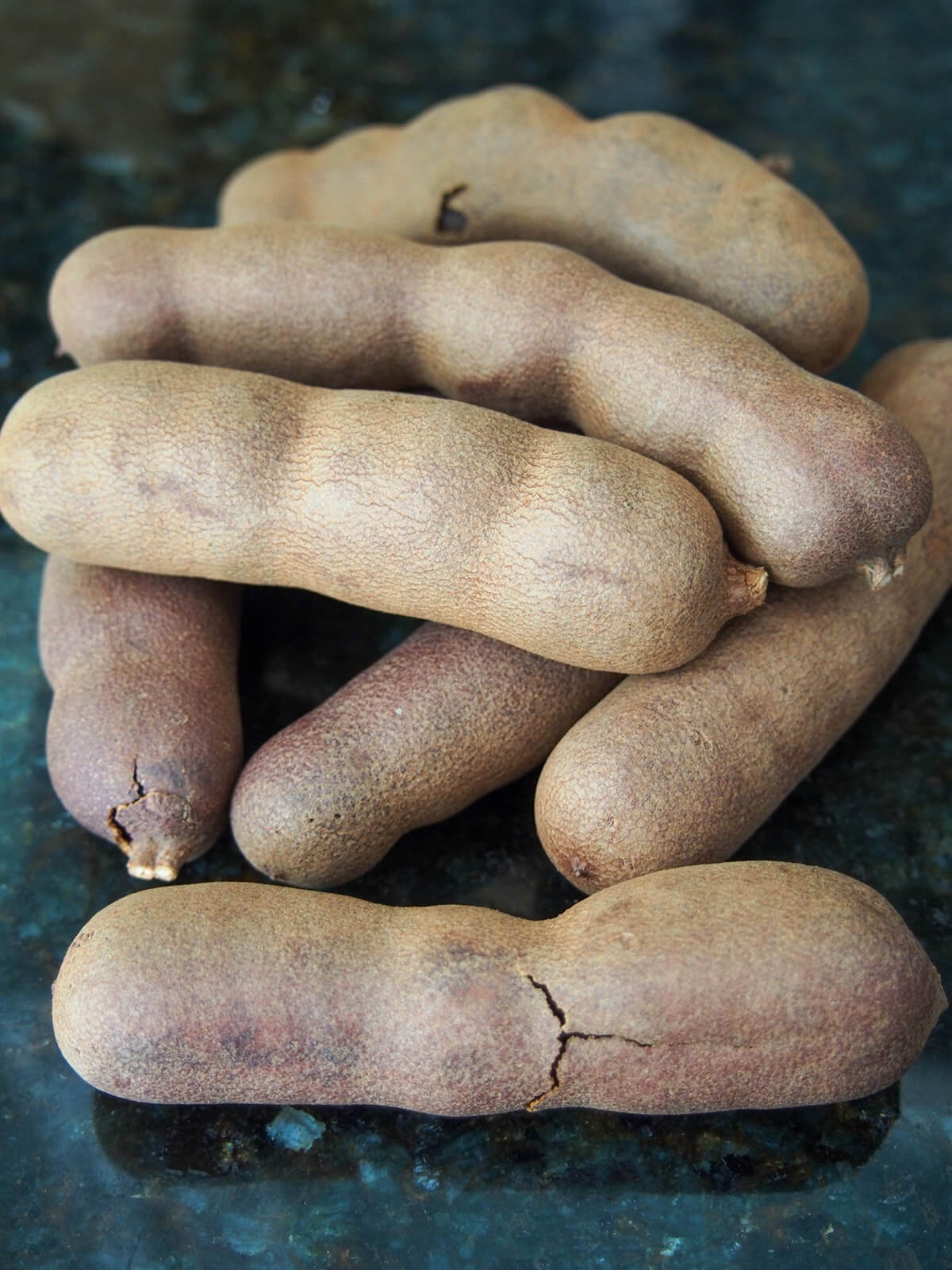 stack of tamarind pods