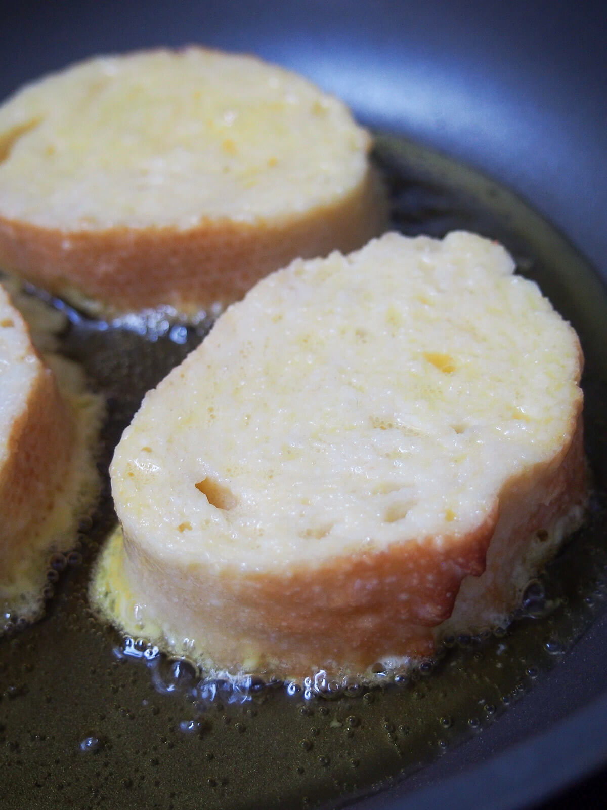 frying slices of egg-dipped, milk-soaked bread