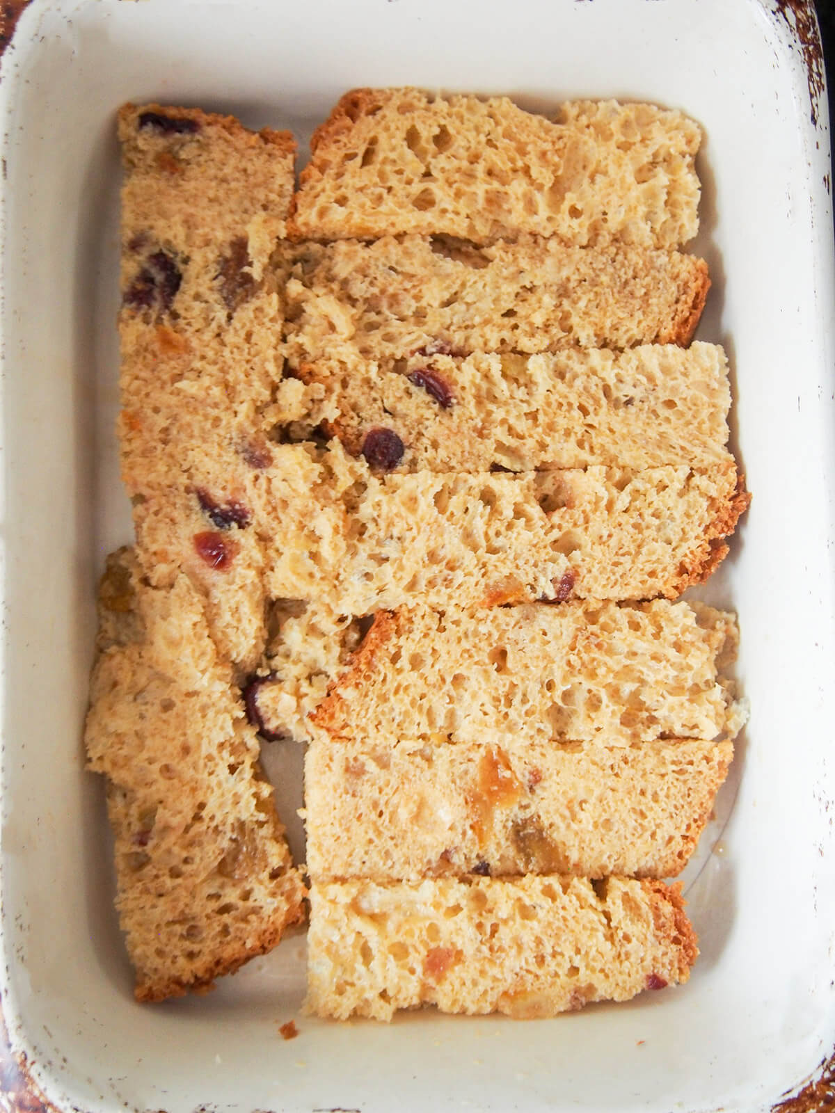 layer of soaked panettone slices in bottom of dish.