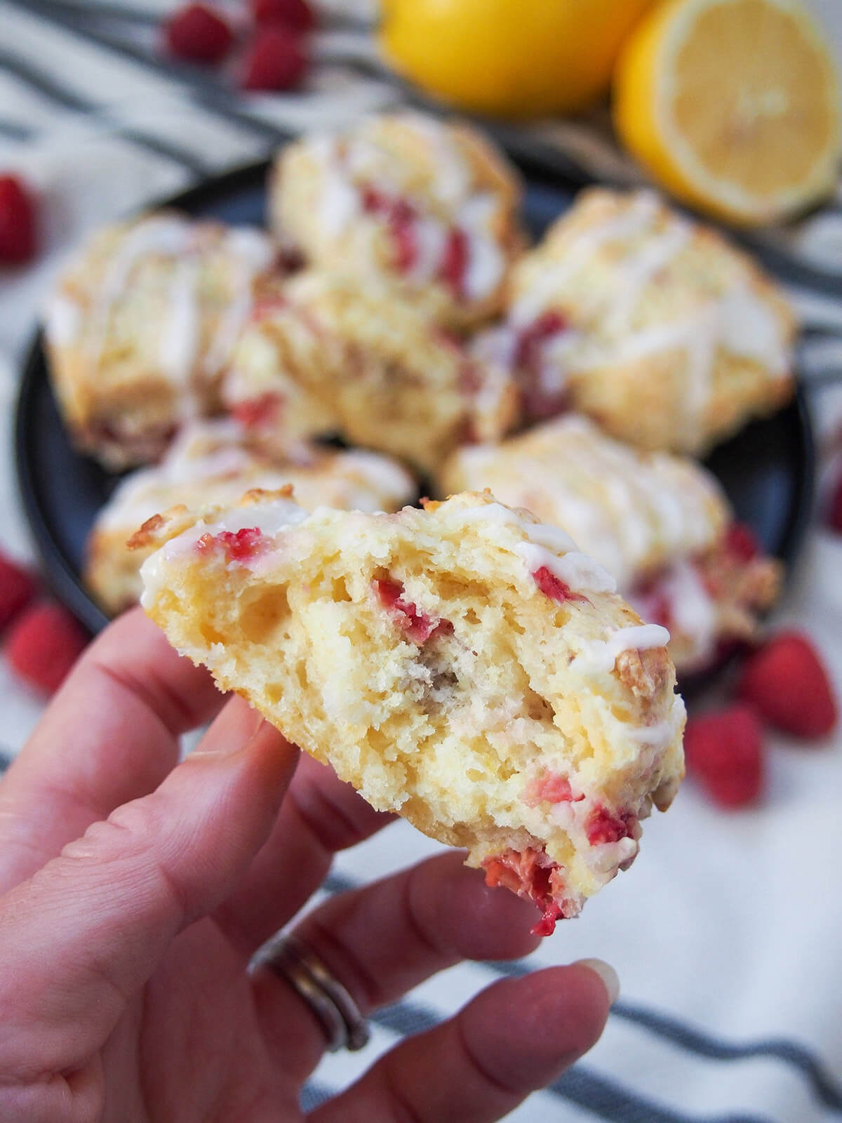 holding a raspberry scone in hand showing inside