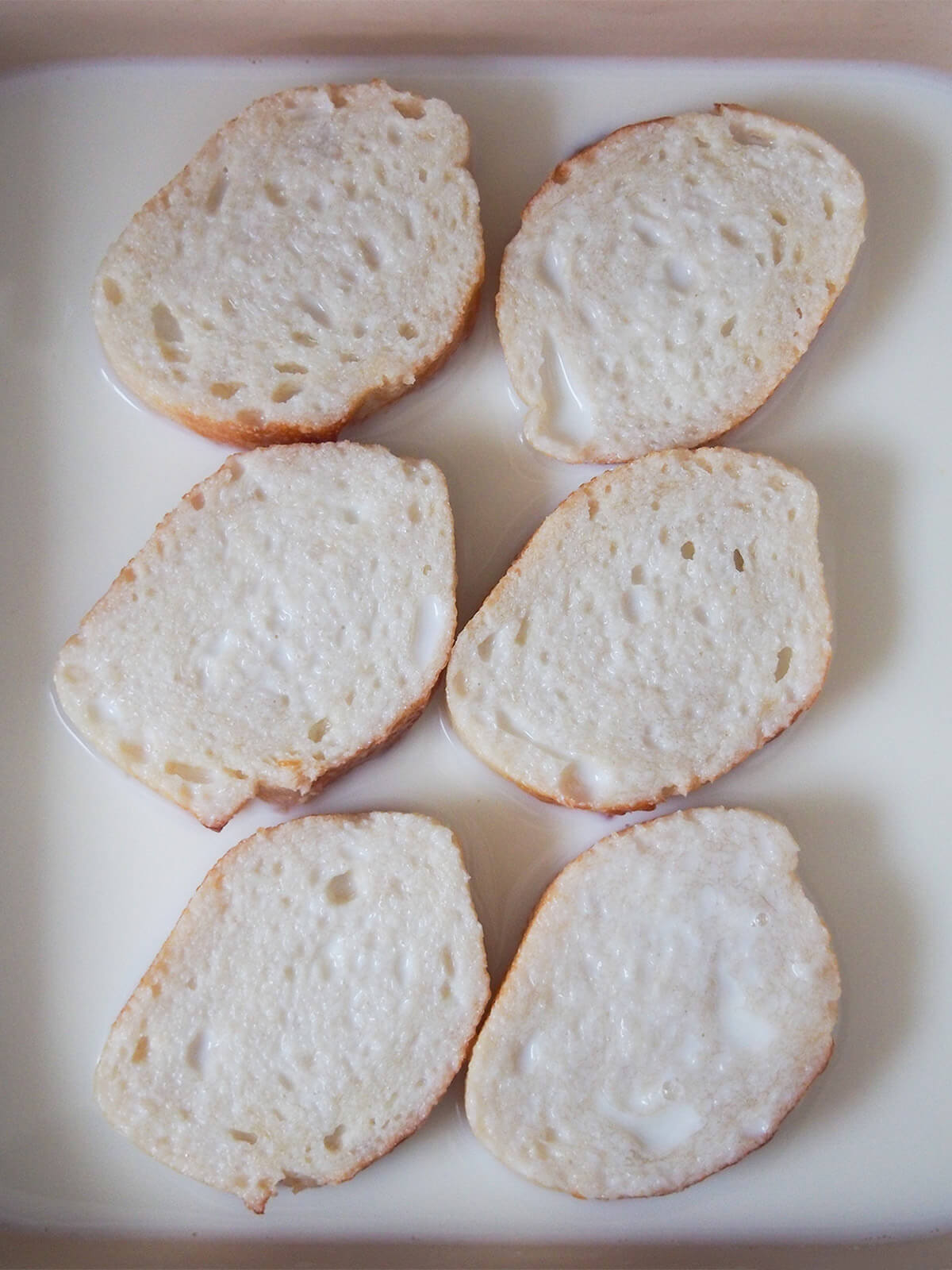 soaking slices of bread in infused milk mixture