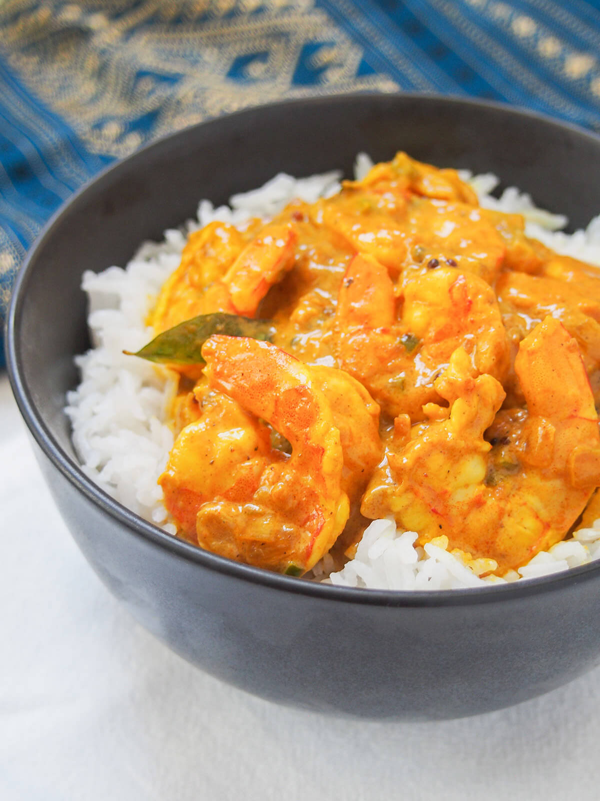 side view of bowl of Malabar prawn curry shrimp