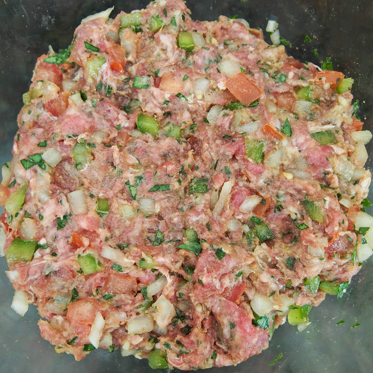 filling for hawawshi meet, spice, onion and green pepper mixture in bowl