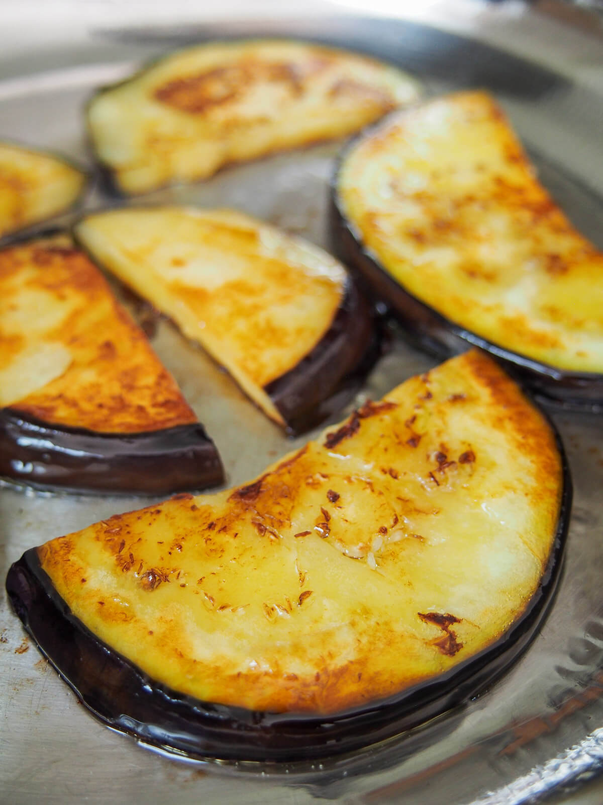 frying slices of eggplant in skillet