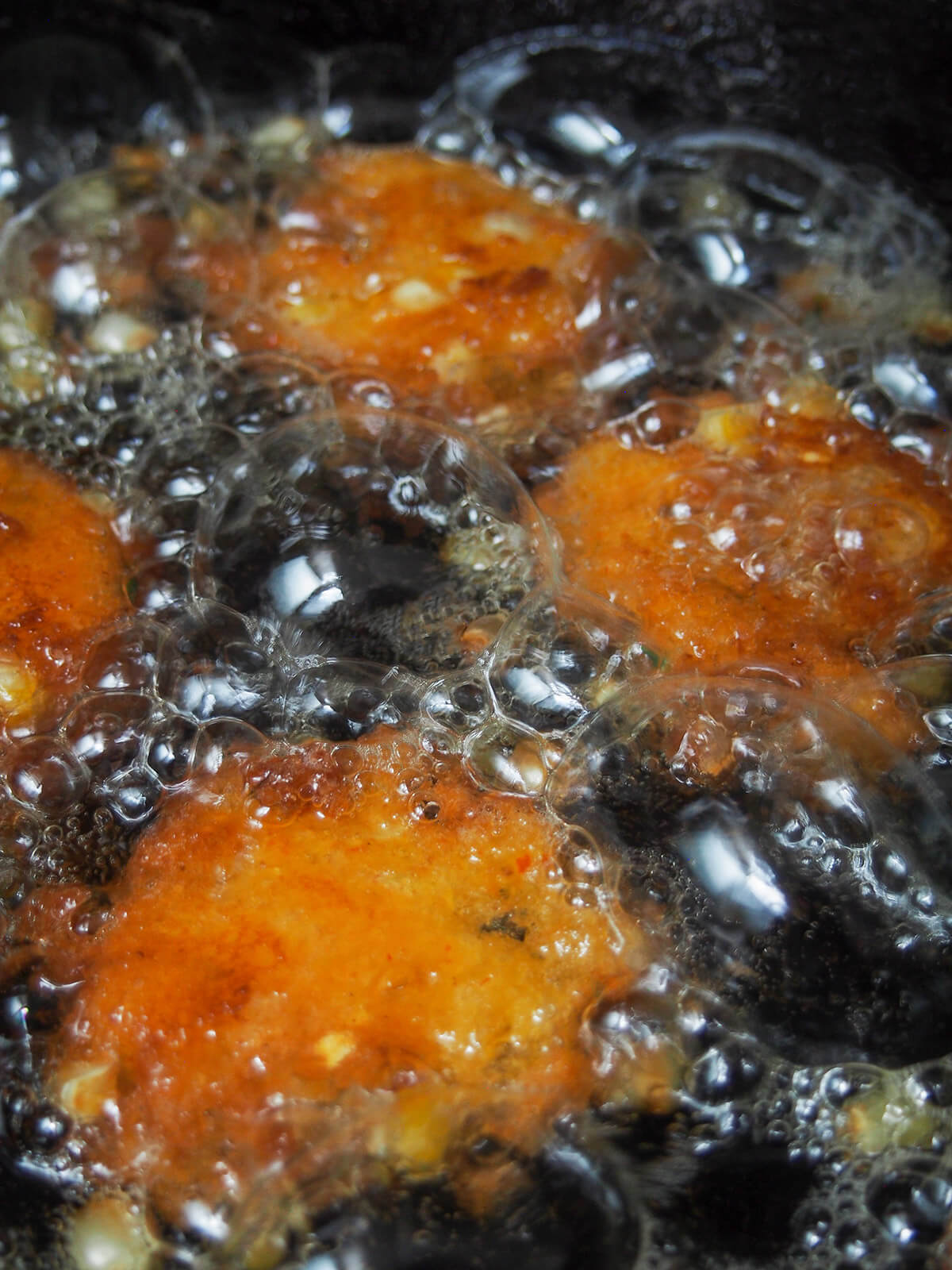 fritters cooking in bubbling oil