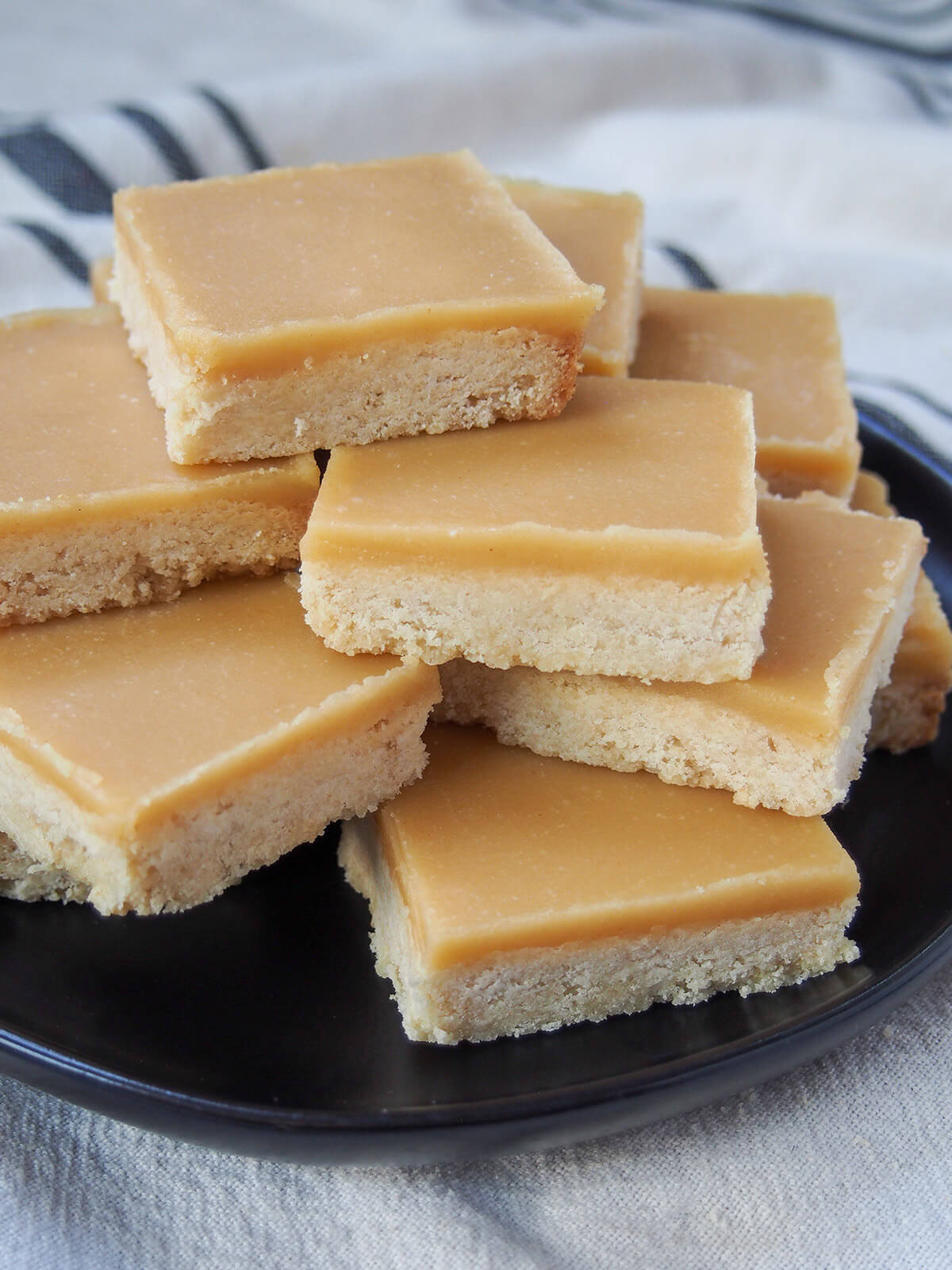 side view of stack of ginger crunch slice on plate