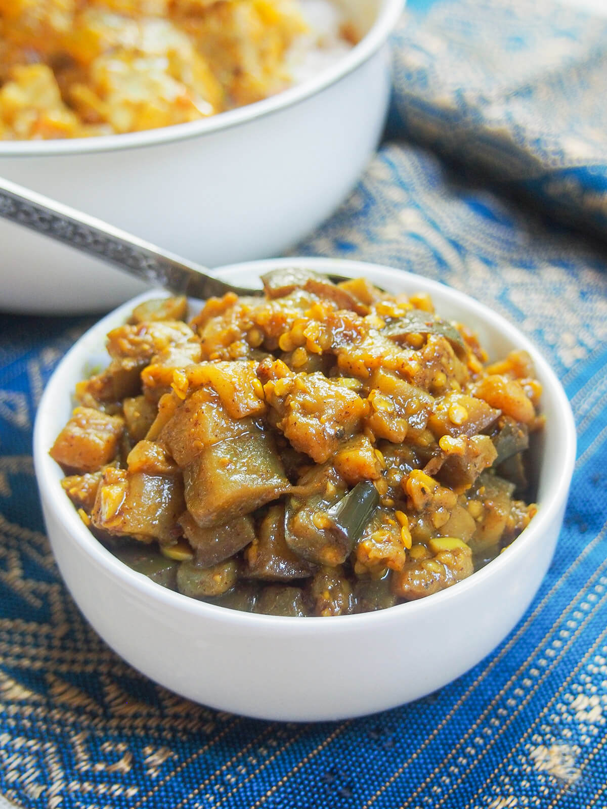 small white bowl filled with brinjal pickle