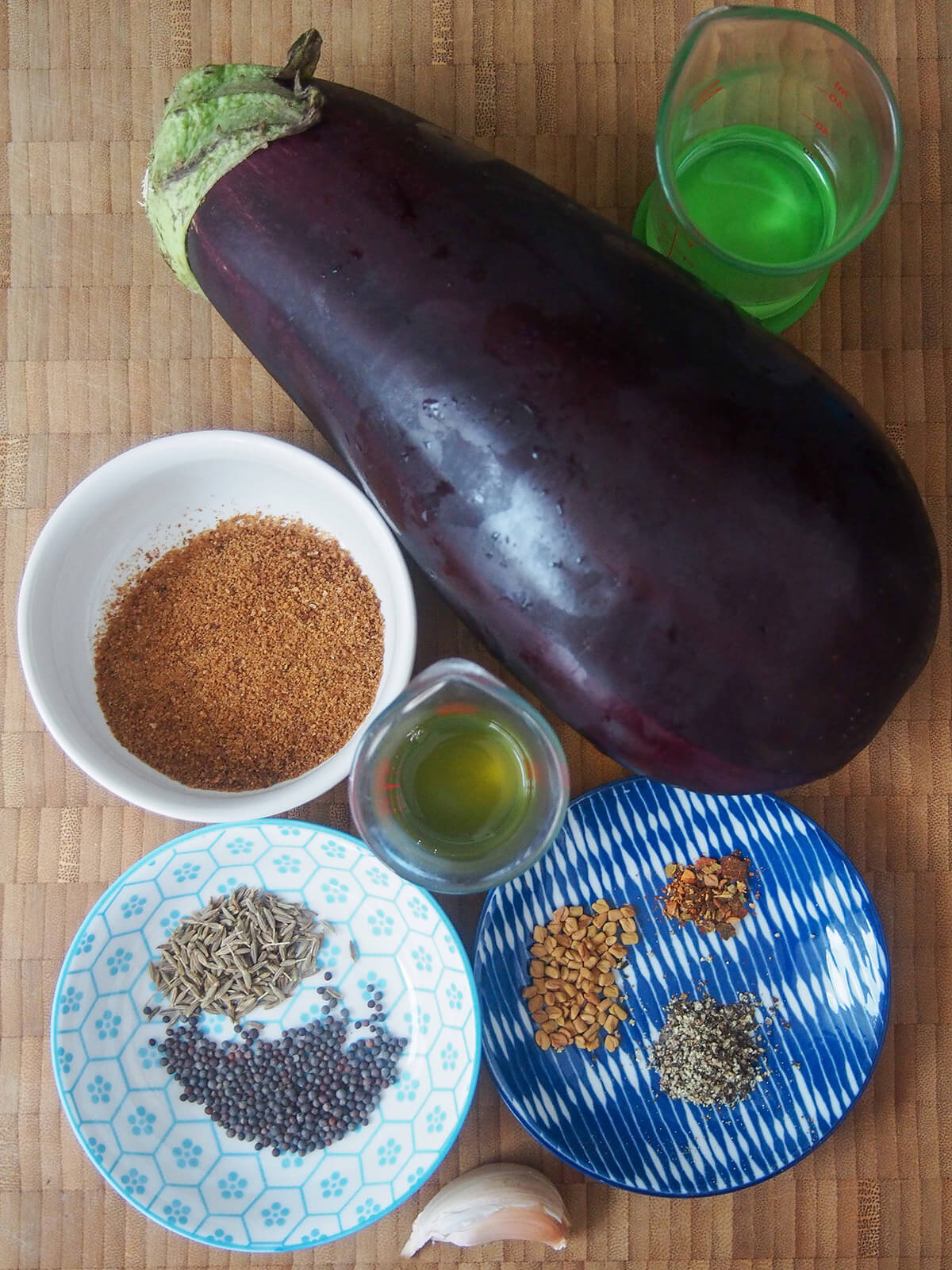 eggplant with small plates with spices and coconut sugar to side