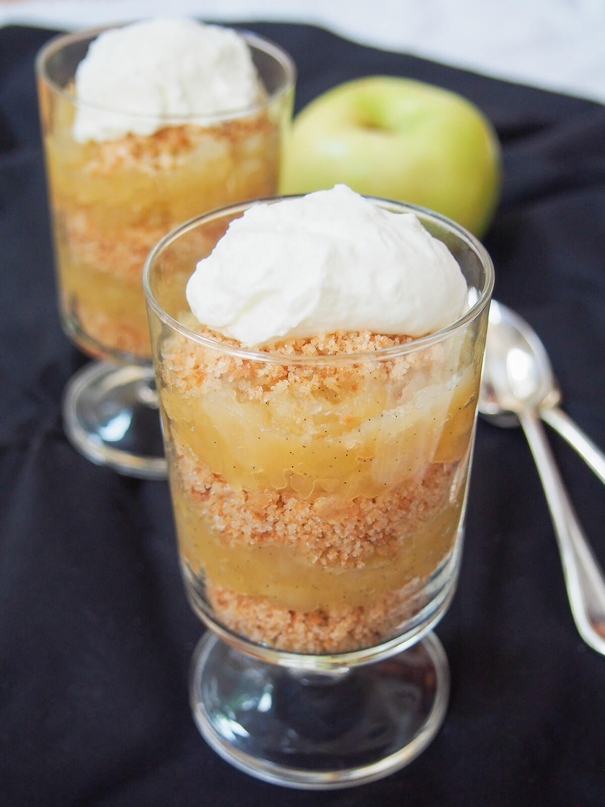 glass of æblekage Danish apple trifle with another glass behind