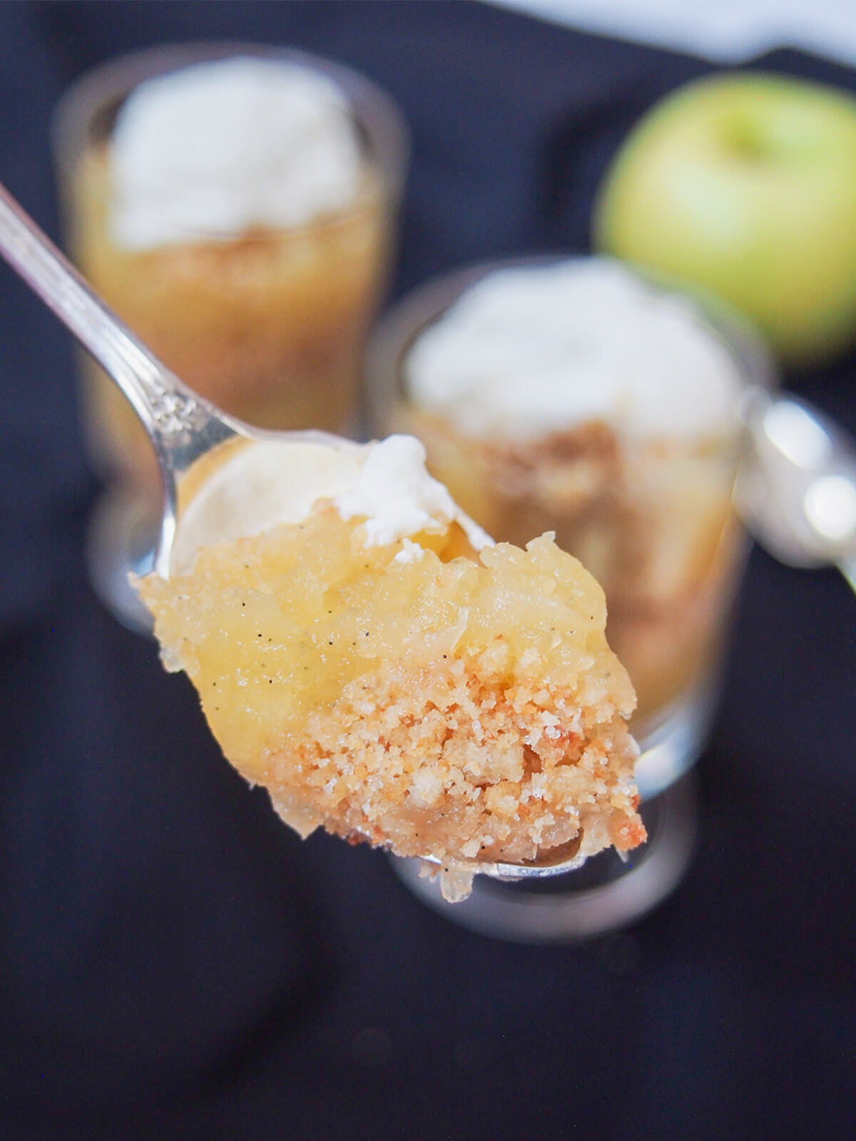 spoonful of æblekage Danish apple trifle showing layers of apple and crumbs