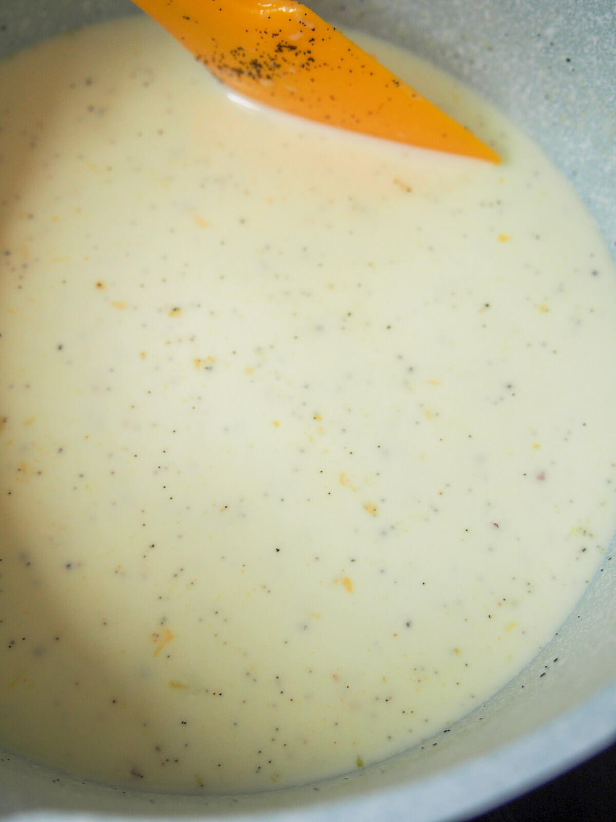 stirring vanilla sauce in pan