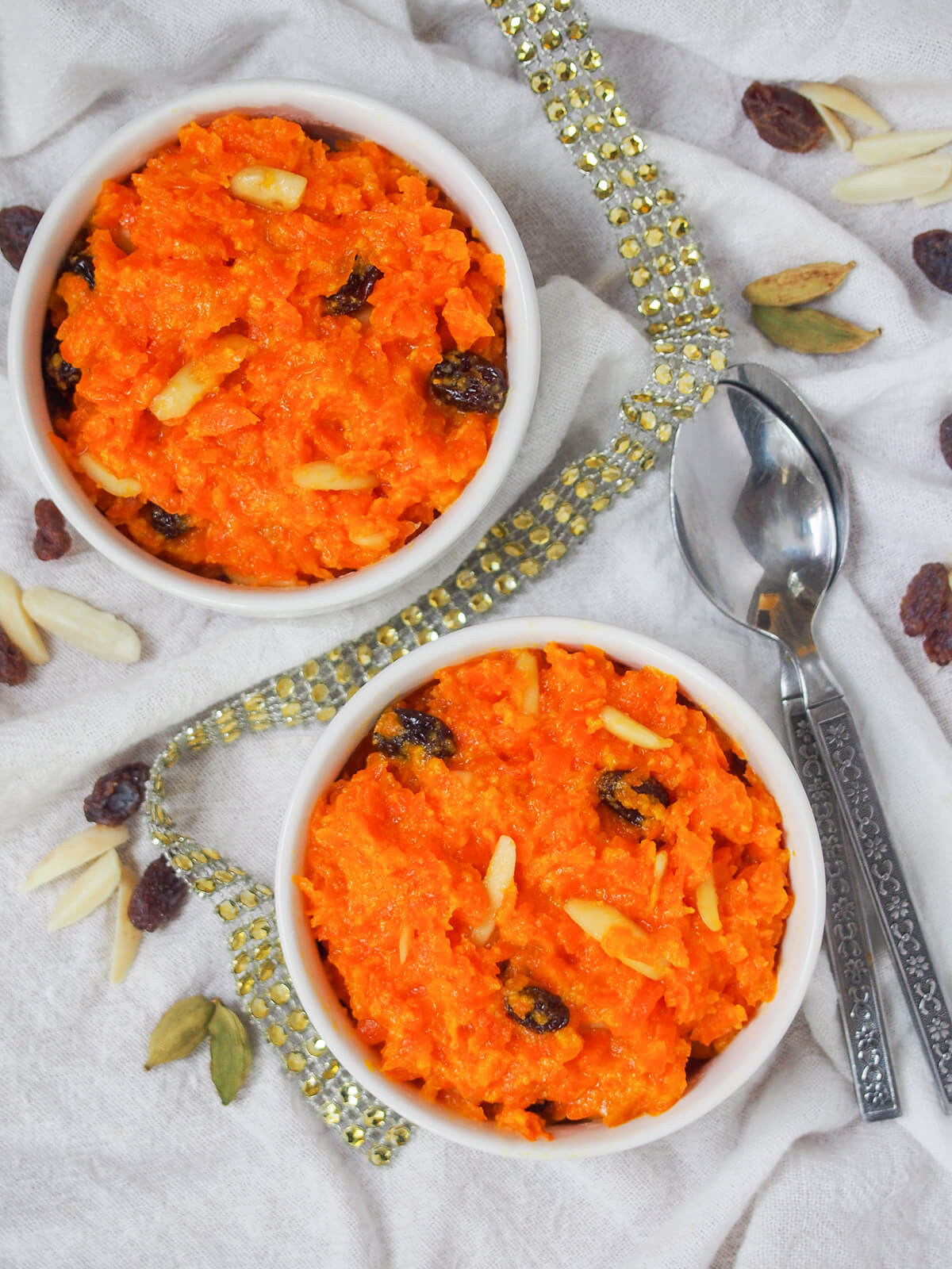 overhead view of two bowls of gajar halwa carrot pudding.