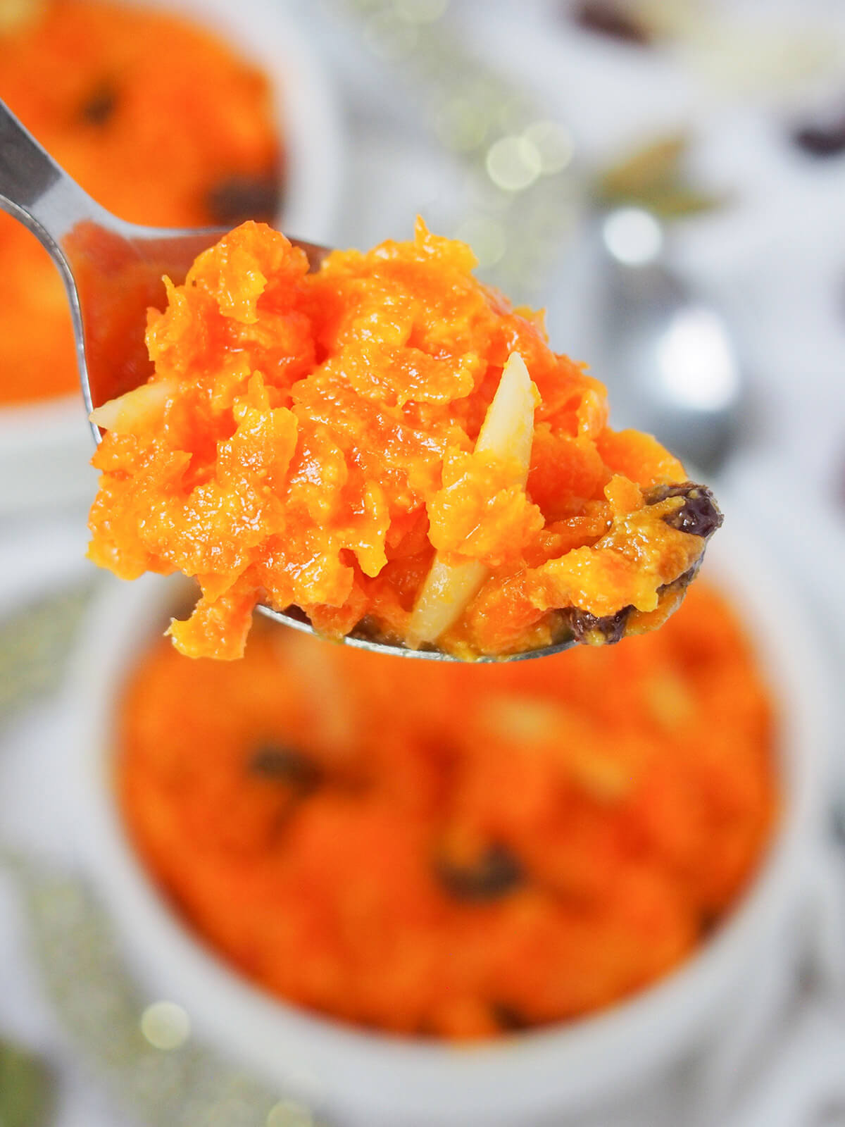 close view of spoonful of gajar halwa carrot pudding