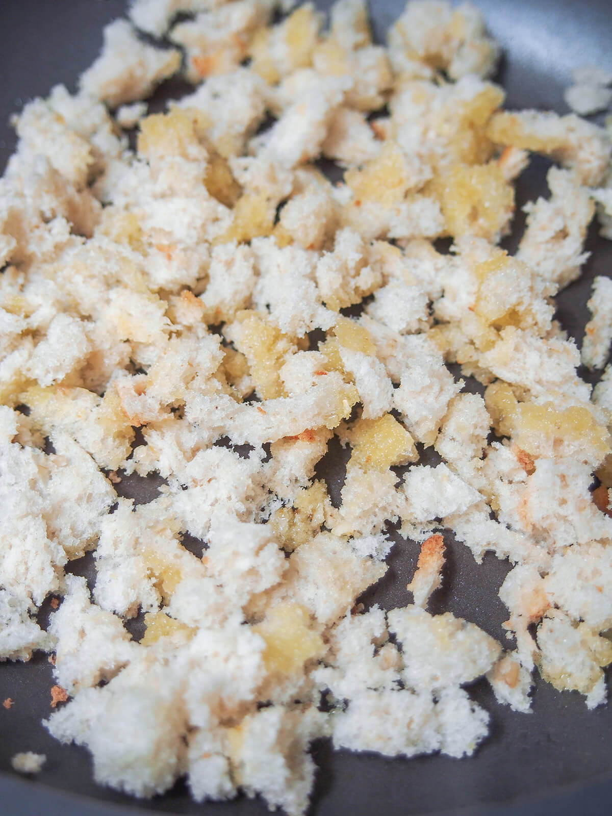 starting to toast bread in butter for pangrattato