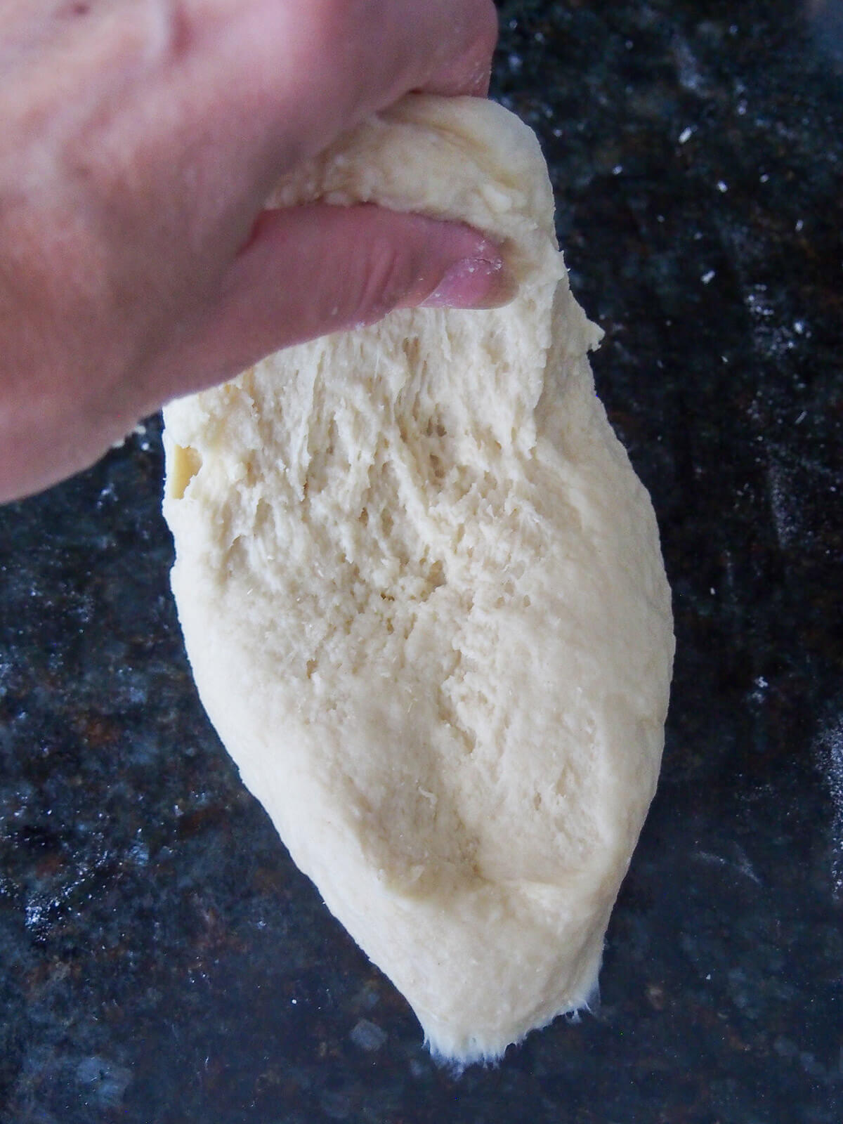 kneading dough for Germknödel, traditional German/Austrian yeast dumplings kneading dumpling dough.