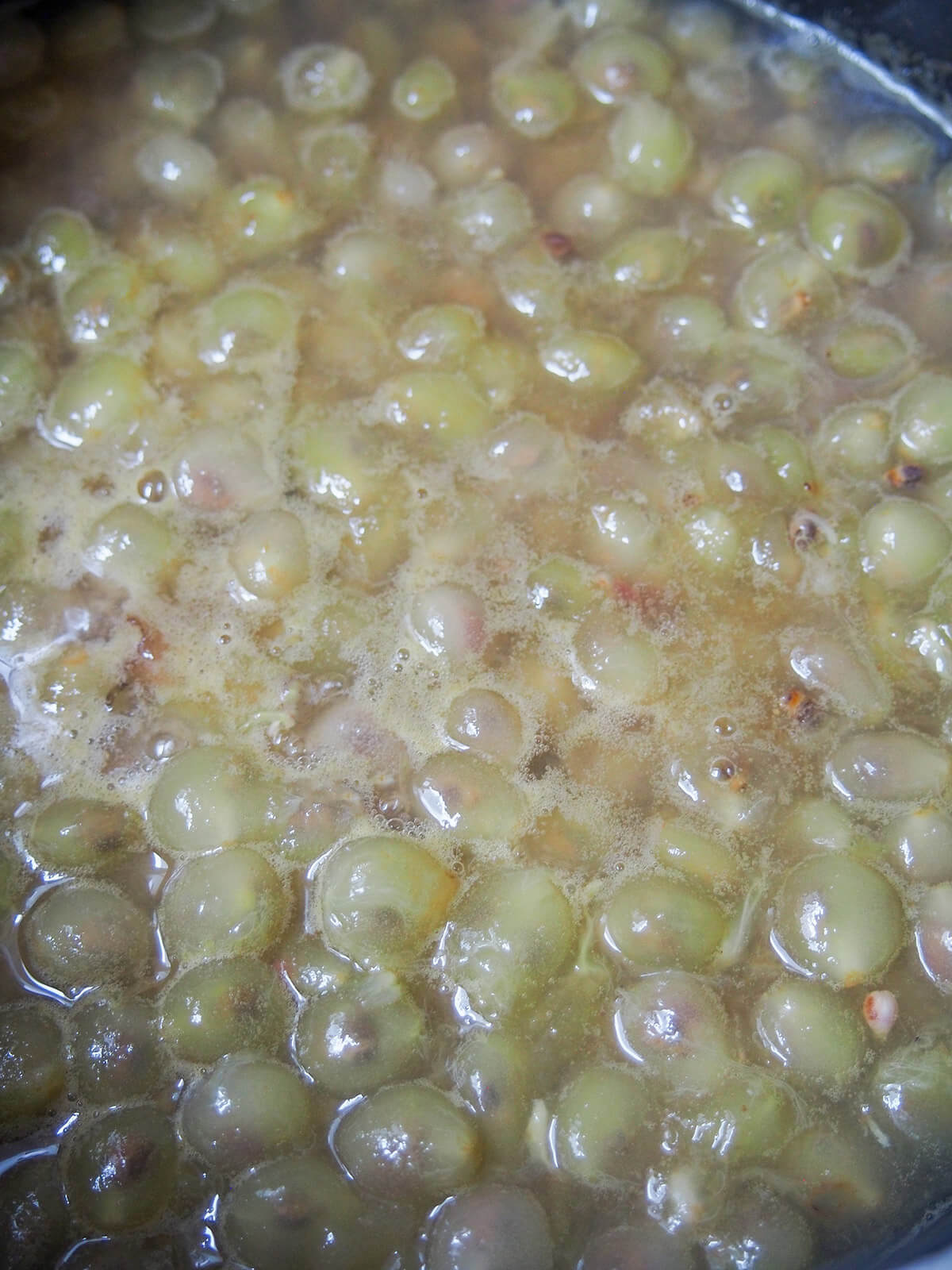simmering grape pulp in a pot grape pulp simmering in pot