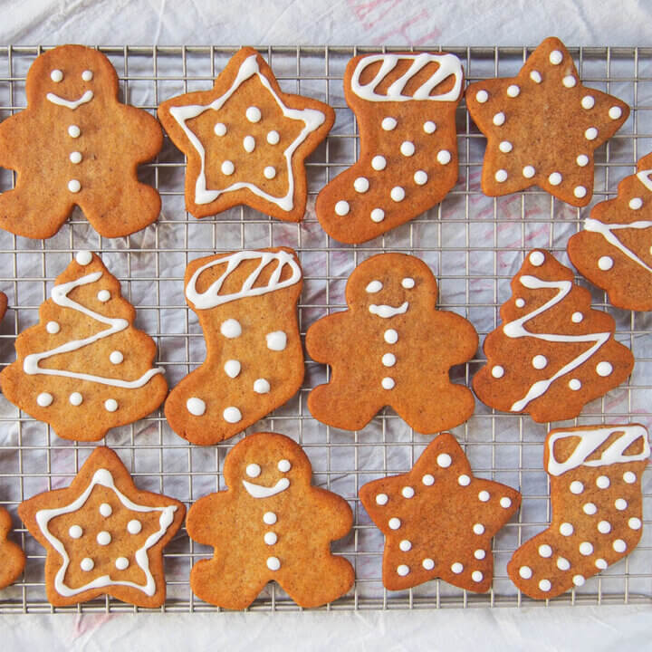 rows of pepparkakor Swedish ginger thins with icing decorations.