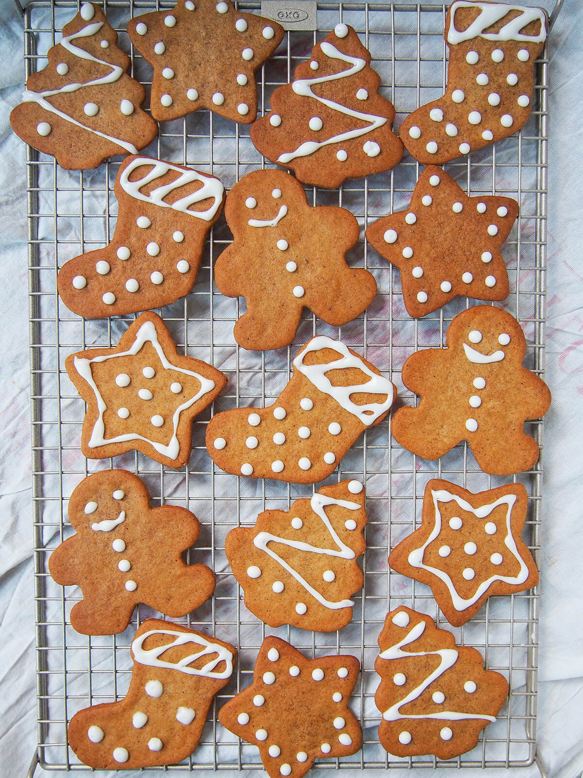 overhead view of pepparkakor Swedish ginger thins on vertical cooling rack.