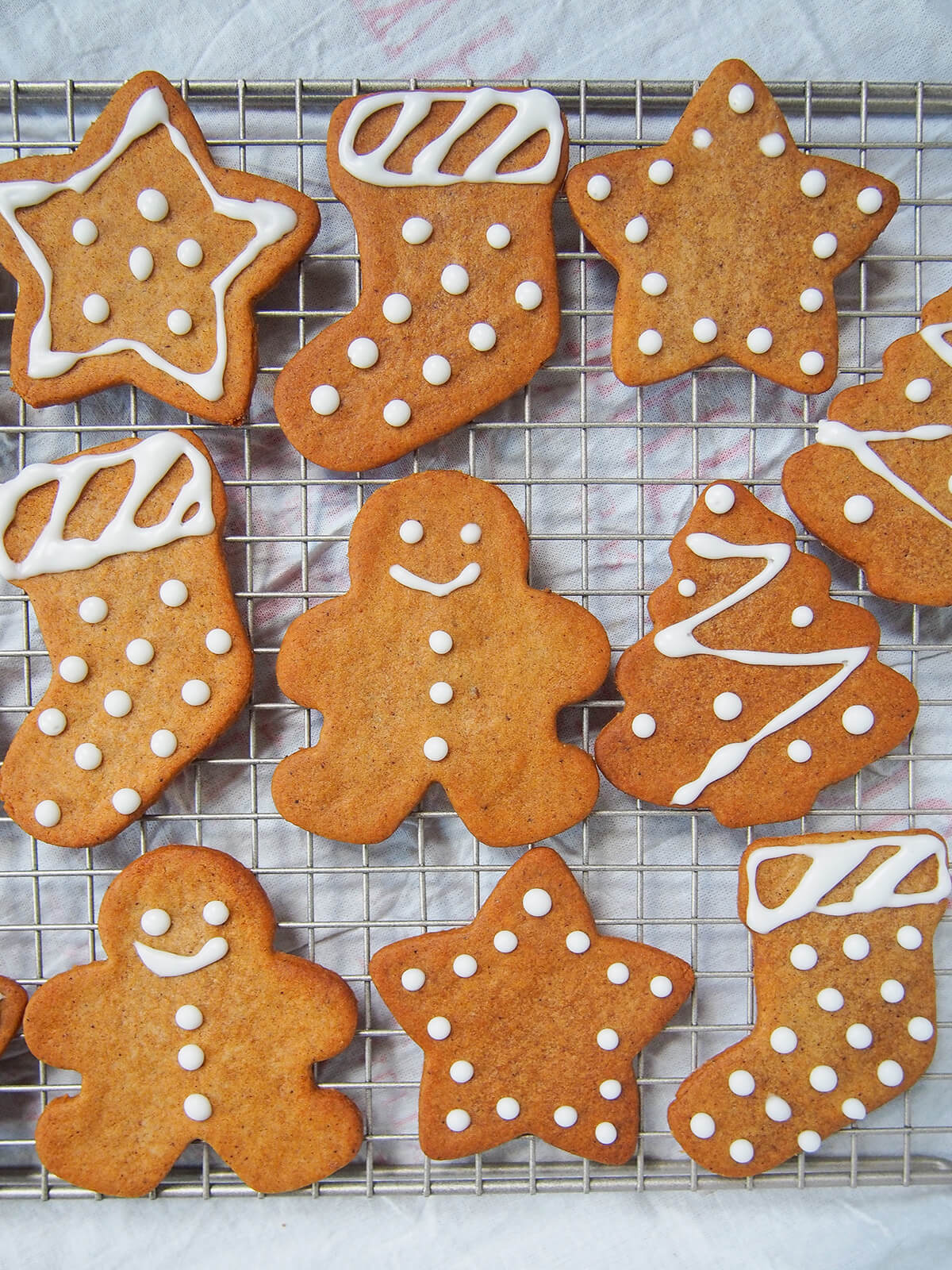 close up view of some pepparkakor Swedish ginger thins with royal icing decoration.