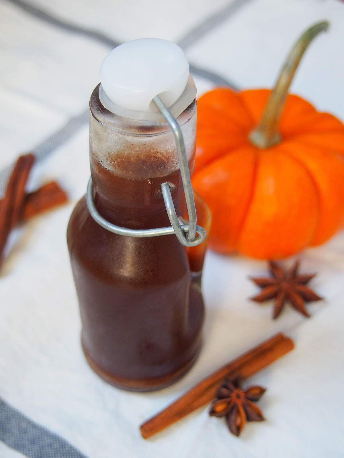 bottle of homemade pumpkin spice syrup from slightly overhead