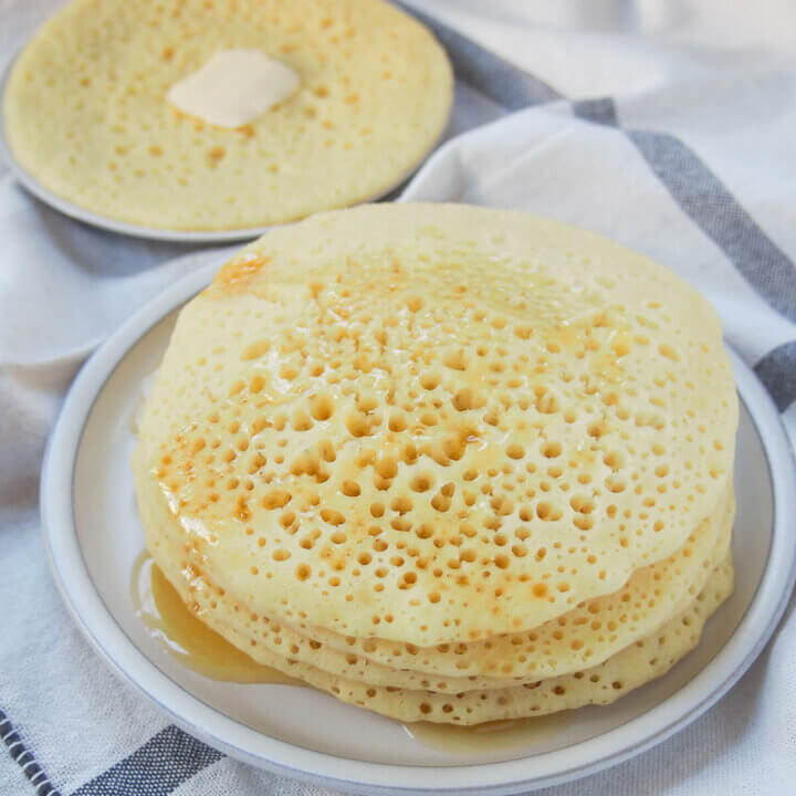 stack of baghrir Moroccan pancakes on plate.