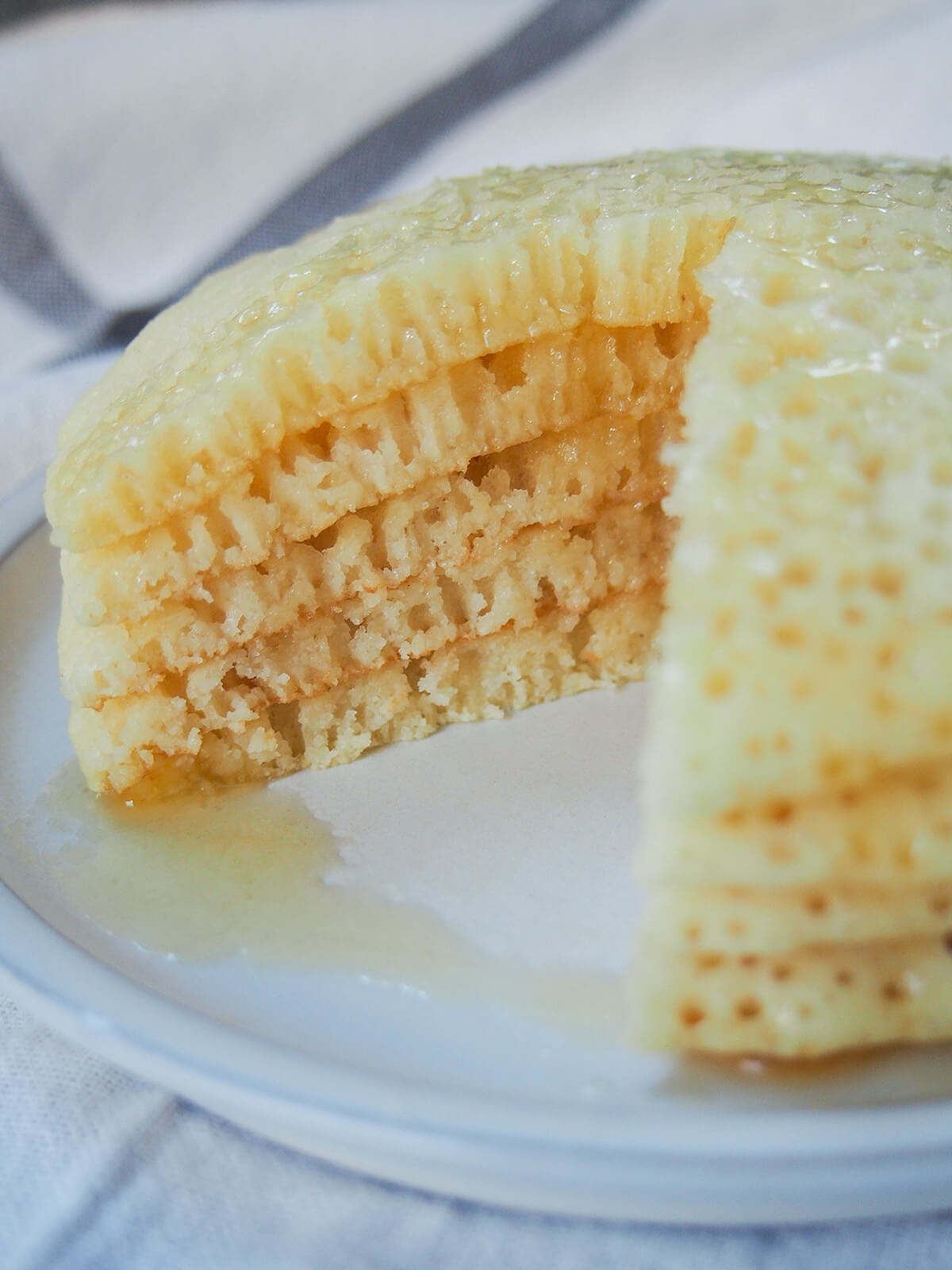 cut stack of baghrir, Moroccan semolina pancakes stack of baghrir pancakes with wedge from them so you can see the texture with air pockets.