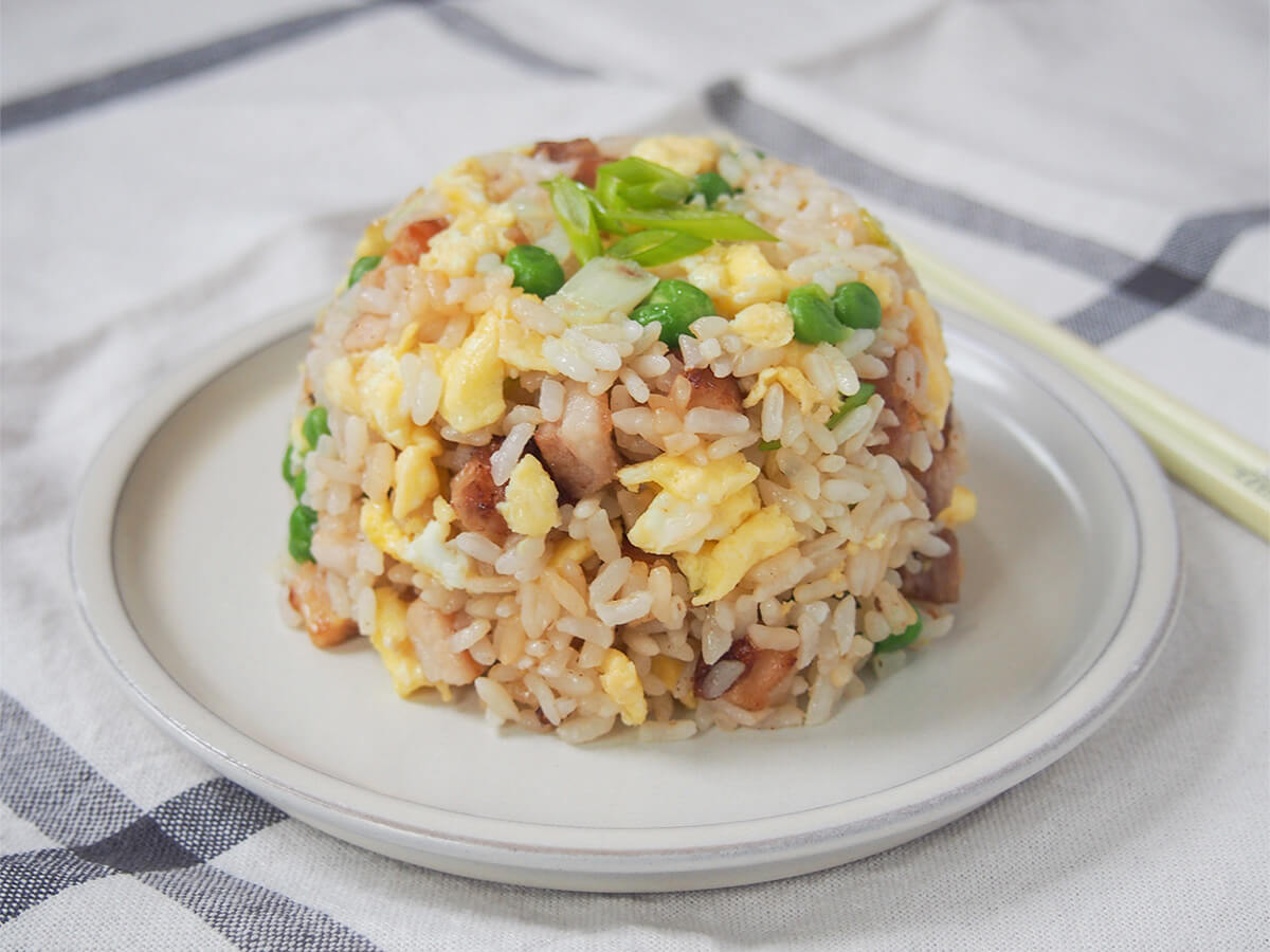 plate with mound of chashu chahan, Japanese fried rice.