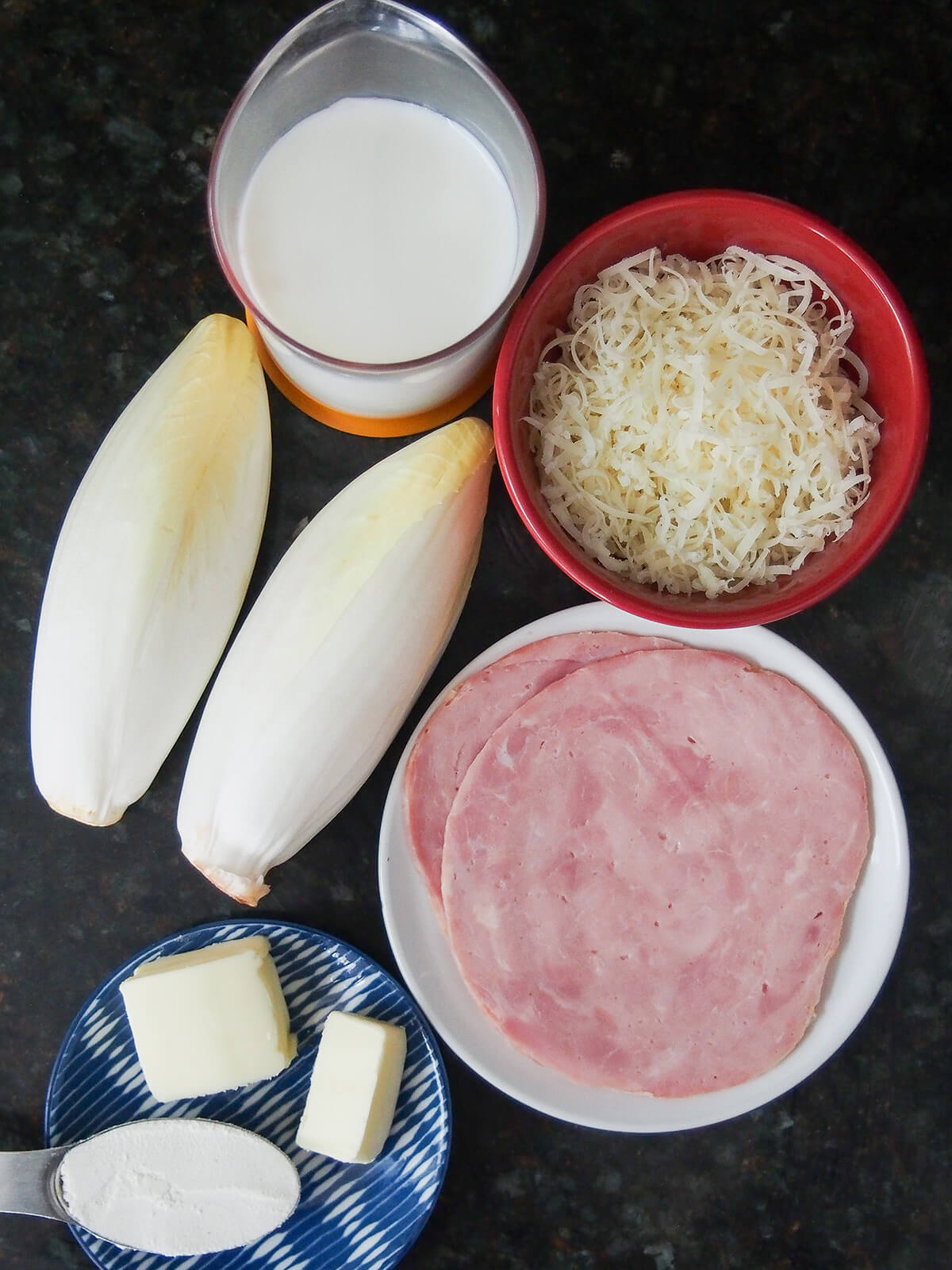 Belgian endives, grated cheese, ham, milk, butter and flour.