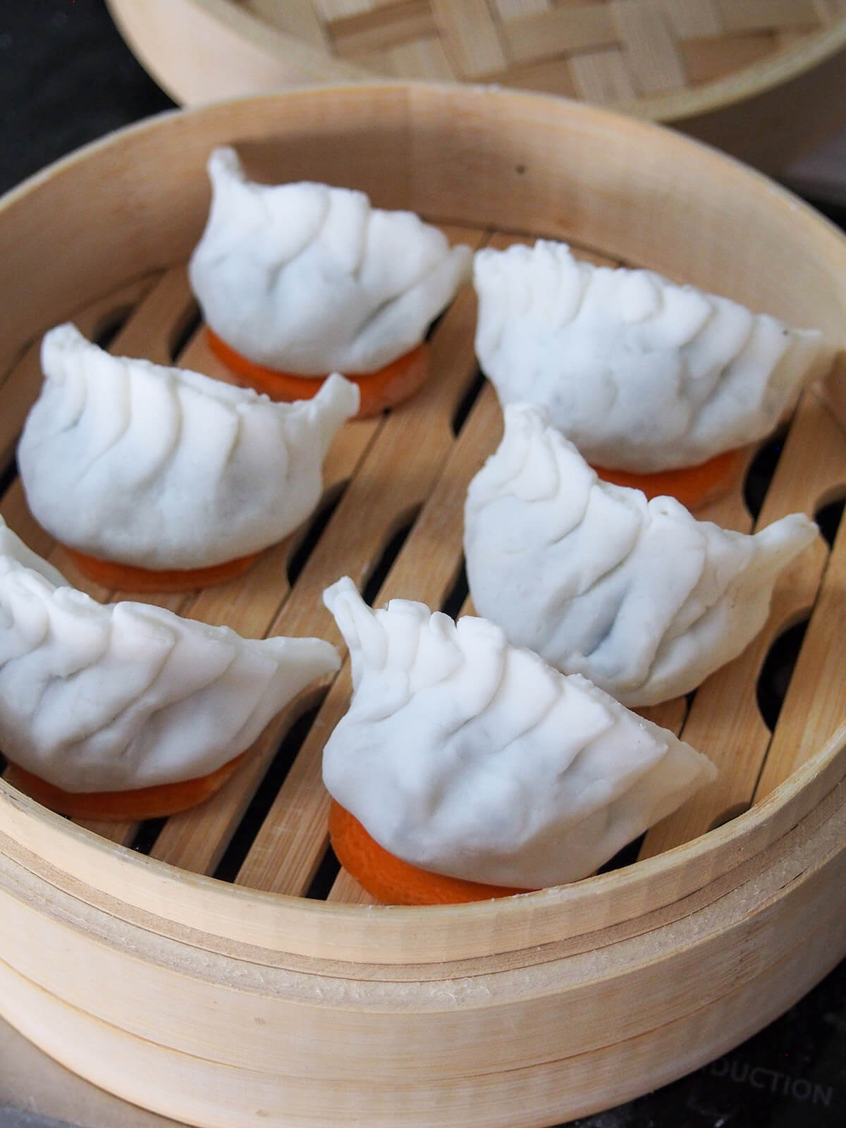 har gow crystal shrimp dumplings before steaming har gow crystal shrimp dumplings in steamer basket before cooking.