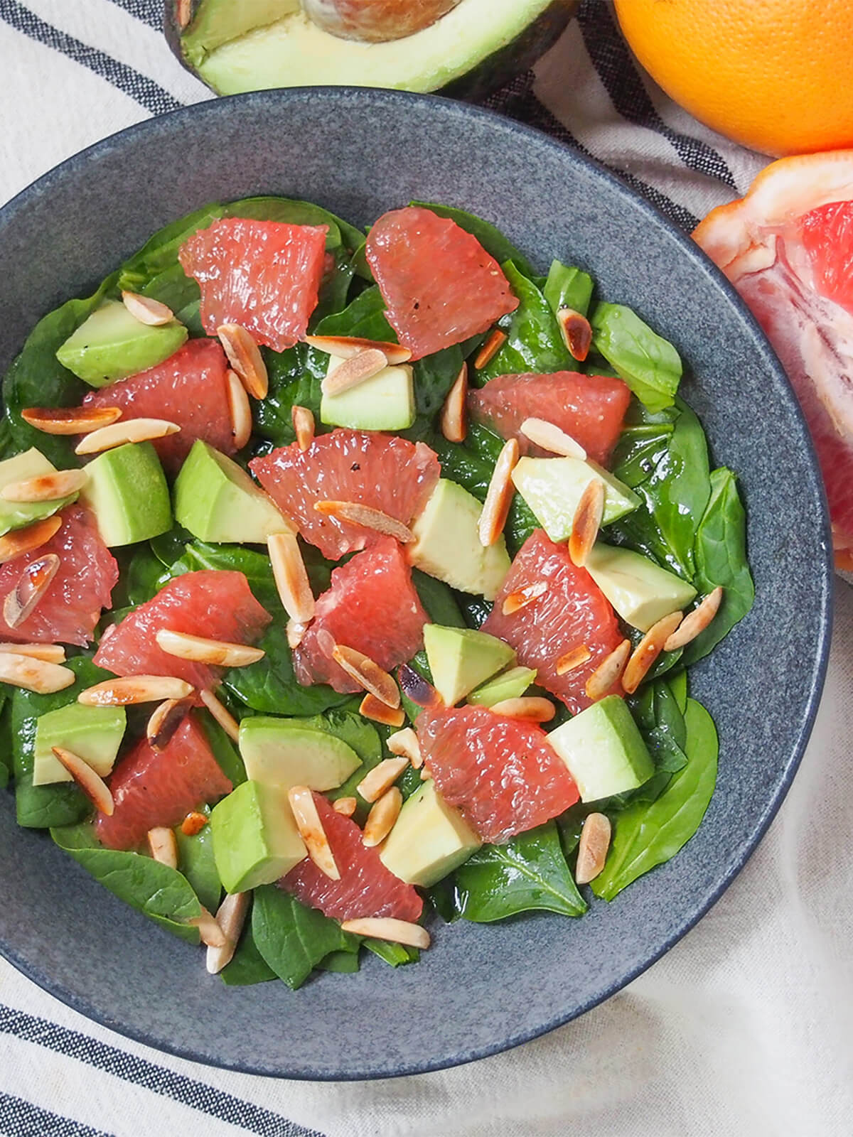 part view of bowl of avocado grapefruit salad from overhead.