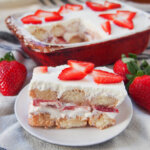 slice of strawberry tiramisu in front of dish with rest