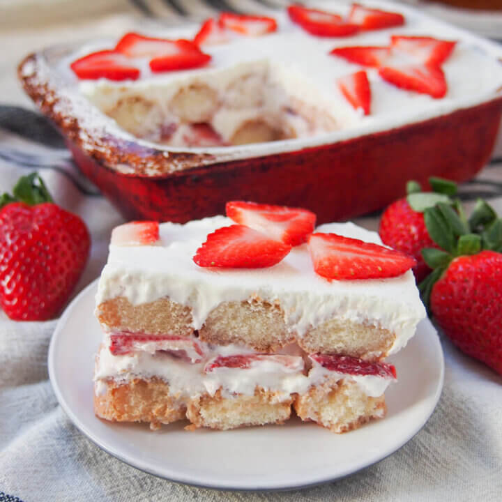 slice of strawberry tiramisu in front of dish with rest