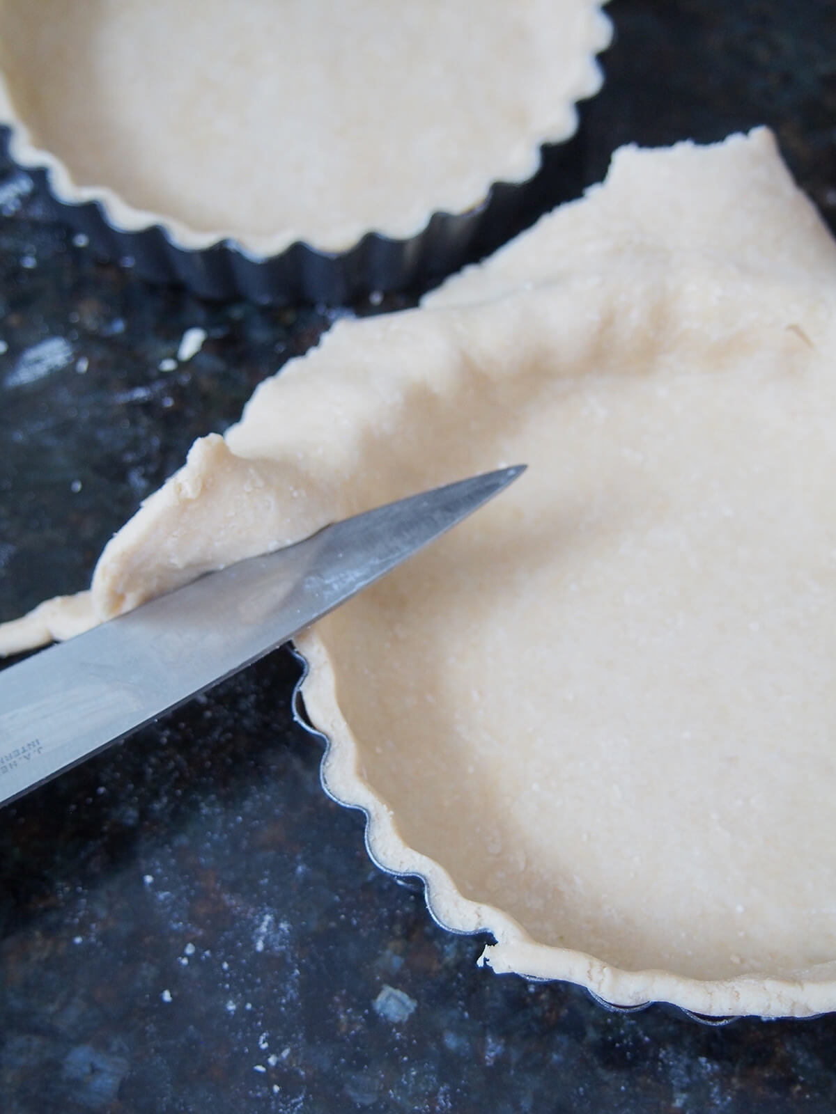 trimming edge of pastry in mini quiche or tart moulds.