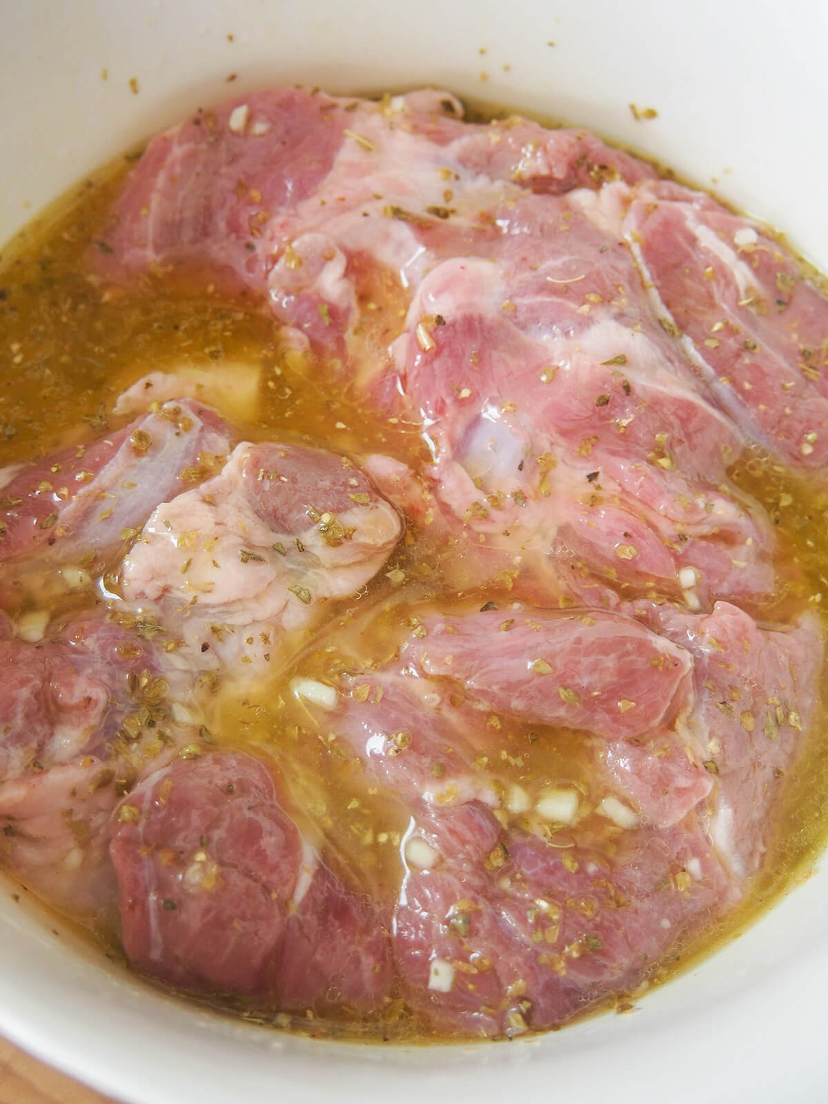 lamb marinating for lamb kleftiko lamb marinating in oil, lemon and herb mixture