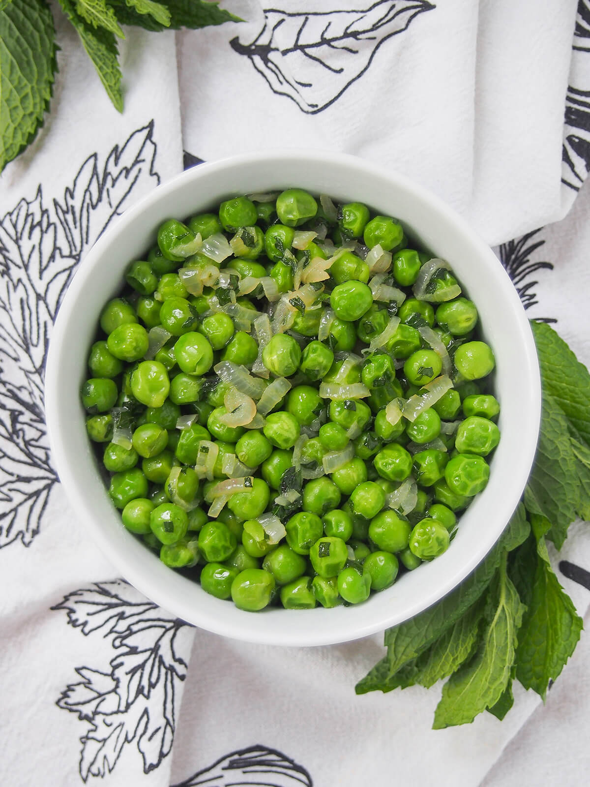 overhead view of bowl of minted peas.