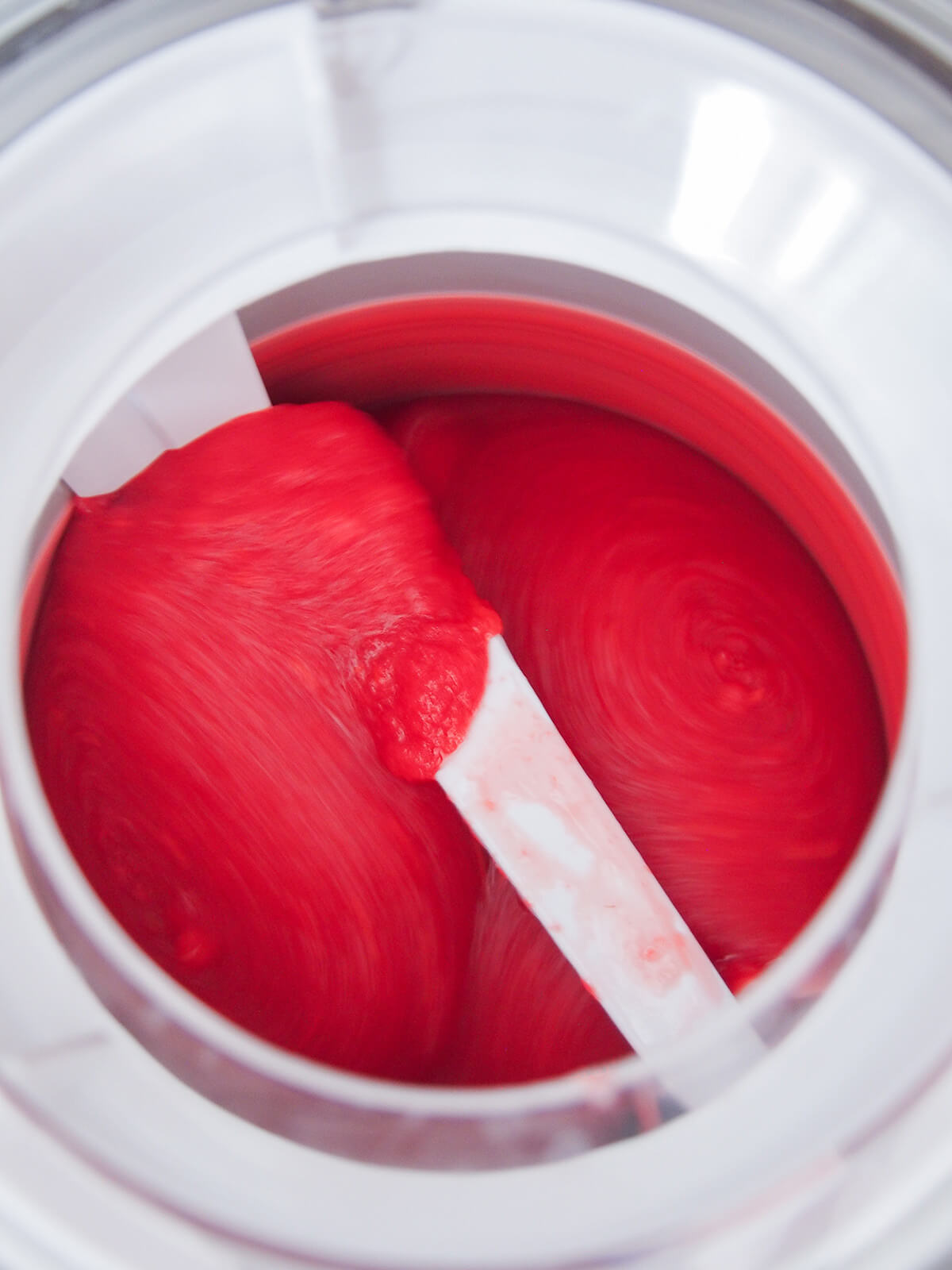 churning raspberry sorbet in ice cream maker