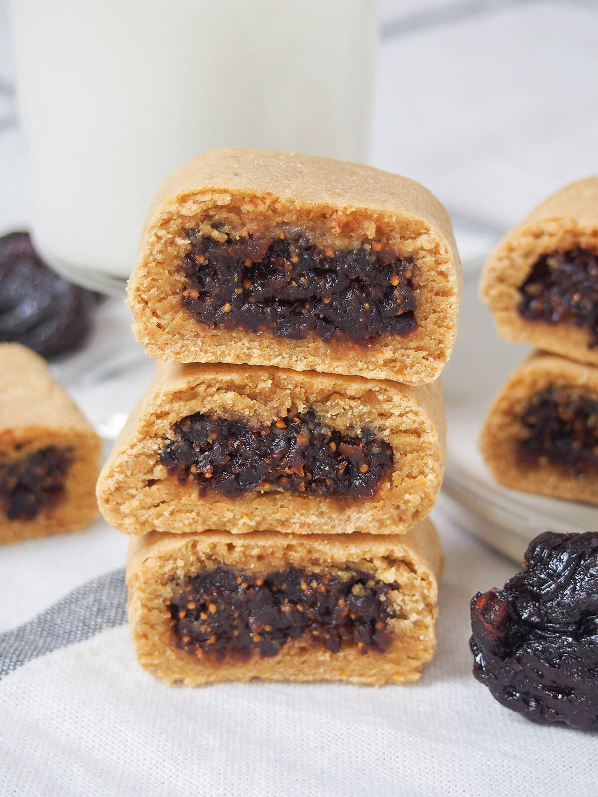 close up of three homemade fig Newtons stacked on top of each other.