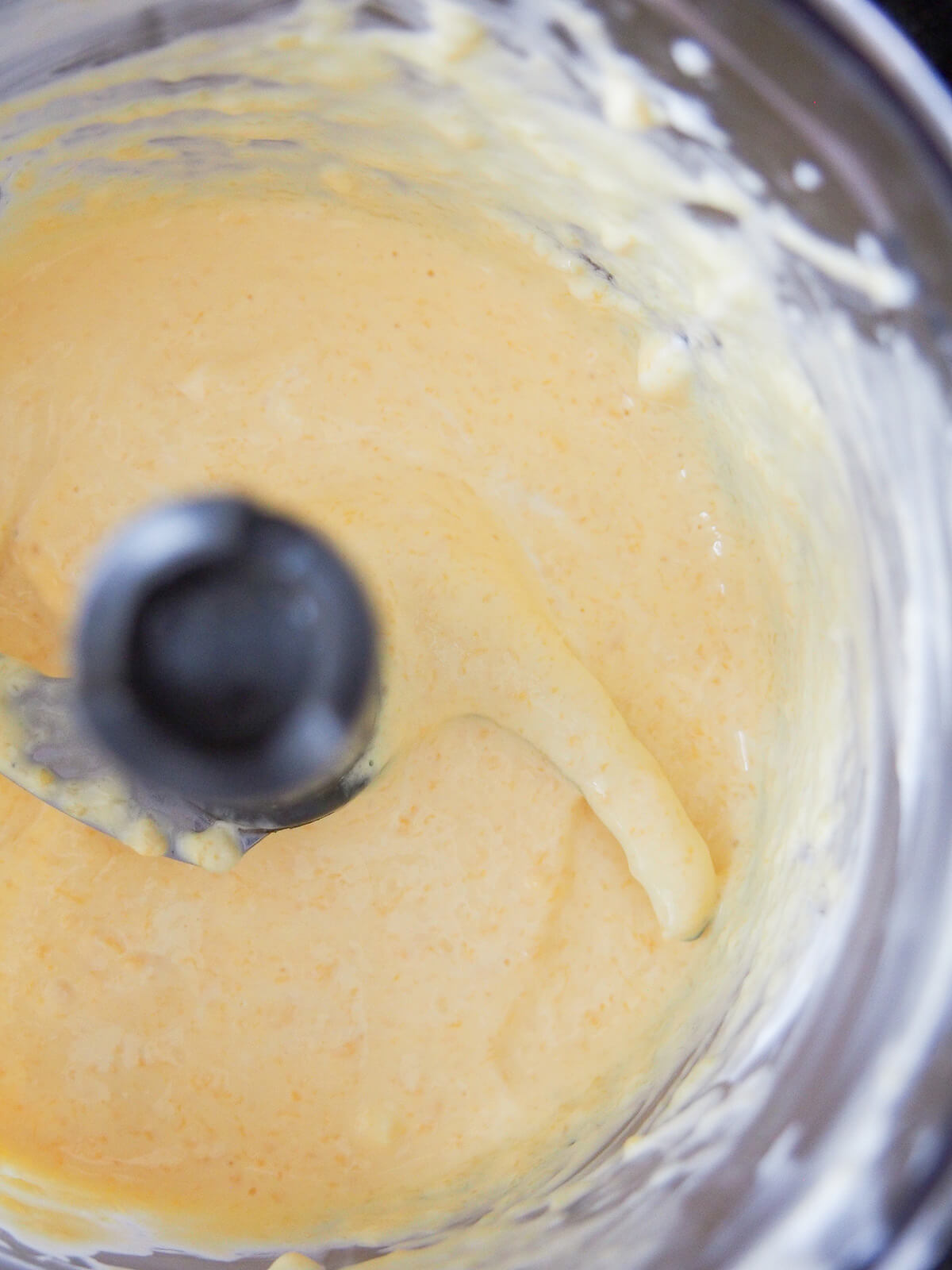 overhead view of mango crema in blender