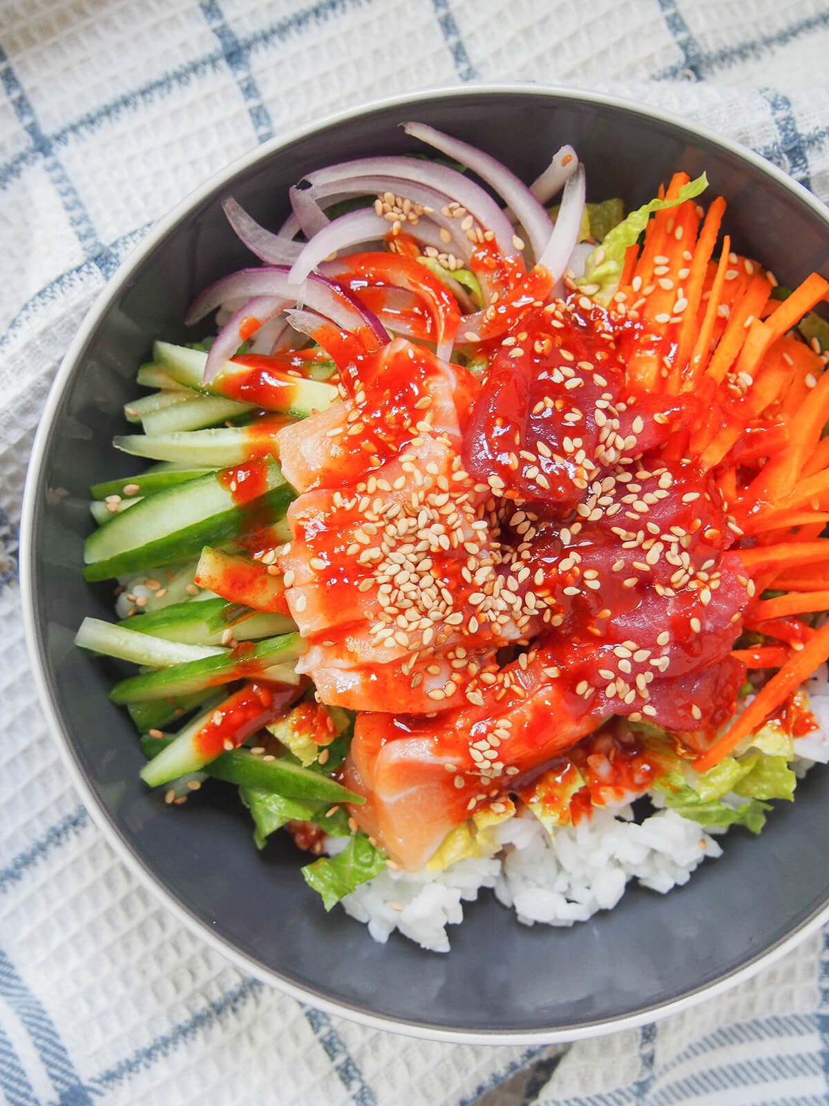 overhead slight close up of Korean sashimi rice bowl, hoedeopbap.