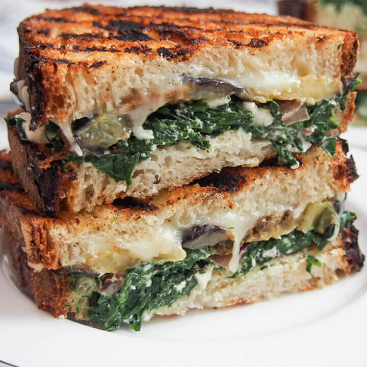 close view of eggplant spinach grilled cheese sandwich.