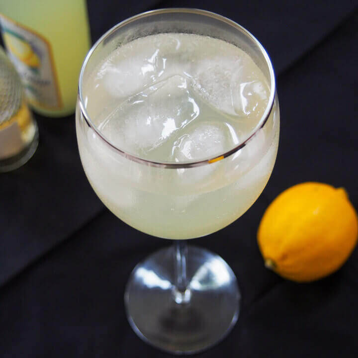 close view of glass of limoncello spritz.