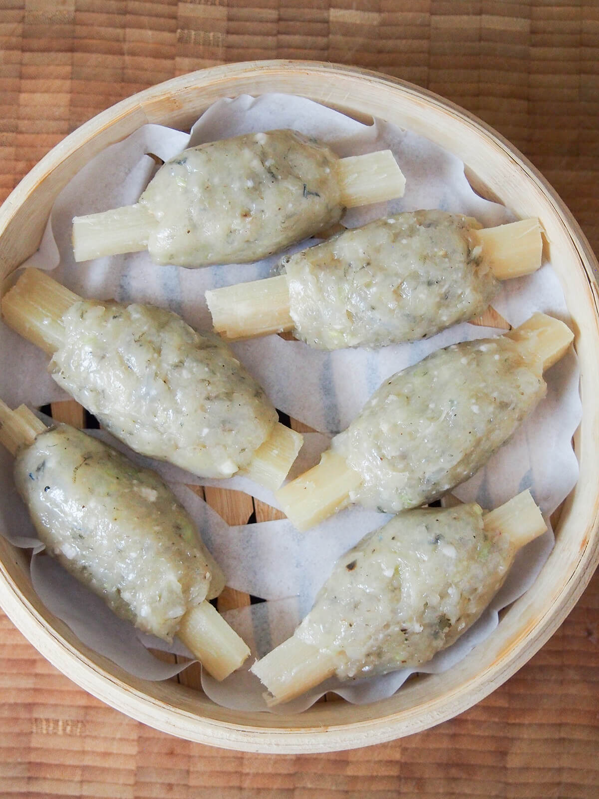 raw Vietnamese sugarcane shrimp in steamer basket before steaming.