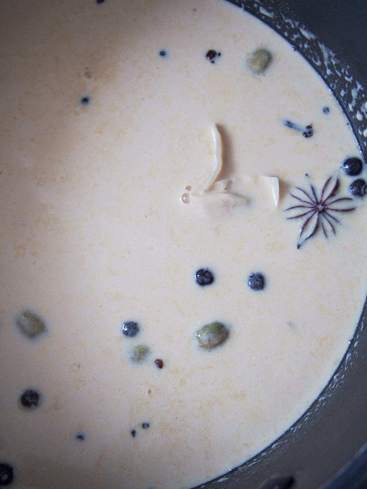 milk and cream mixture starting to go a little brown from spices and tea bag steeping in it.