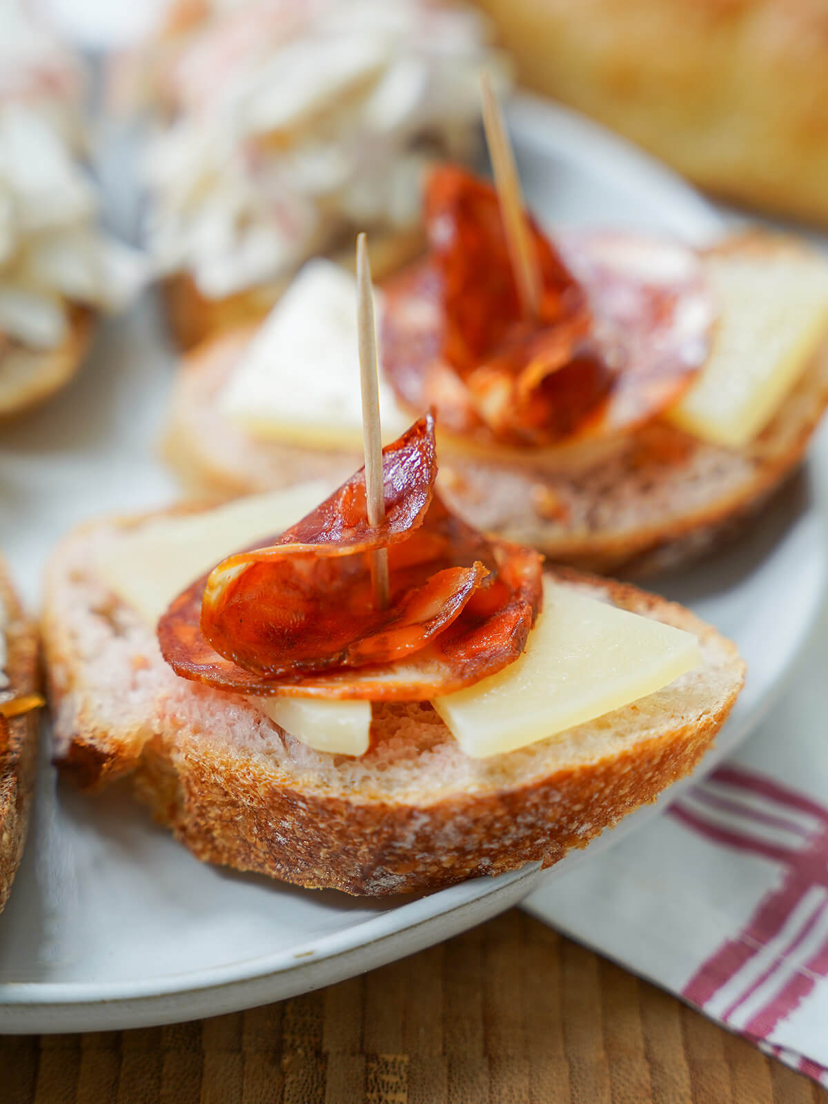Manchego cheese and chorizo pintxo -one of many easy Spanish pintxos recipes close up view of manchego cheese and chorizo pintxo.