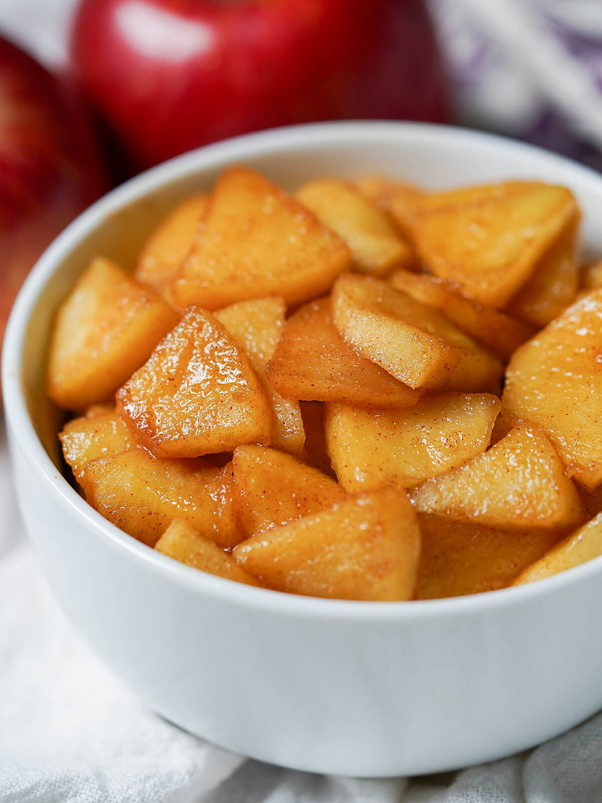 side close up view of bowl of caramelized apples.