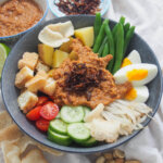 Gado gado (Indonesian salad with peanut sauce) in bowl.