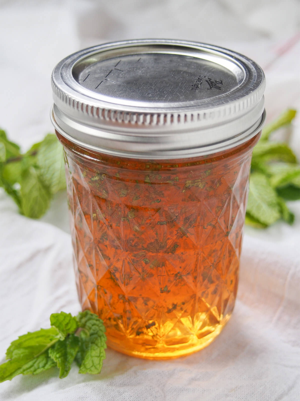 jar of mint jelly with lid on top.
