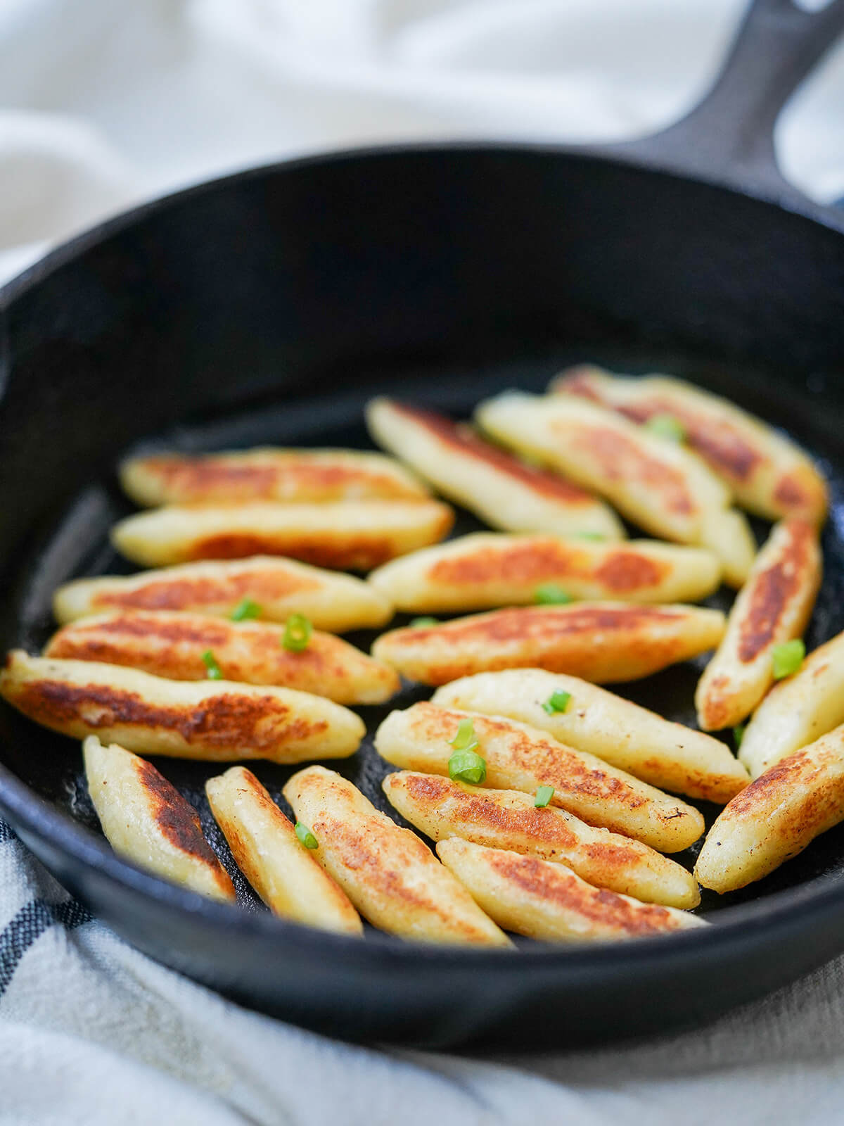 side close view Schupfnudeln in a skillet.