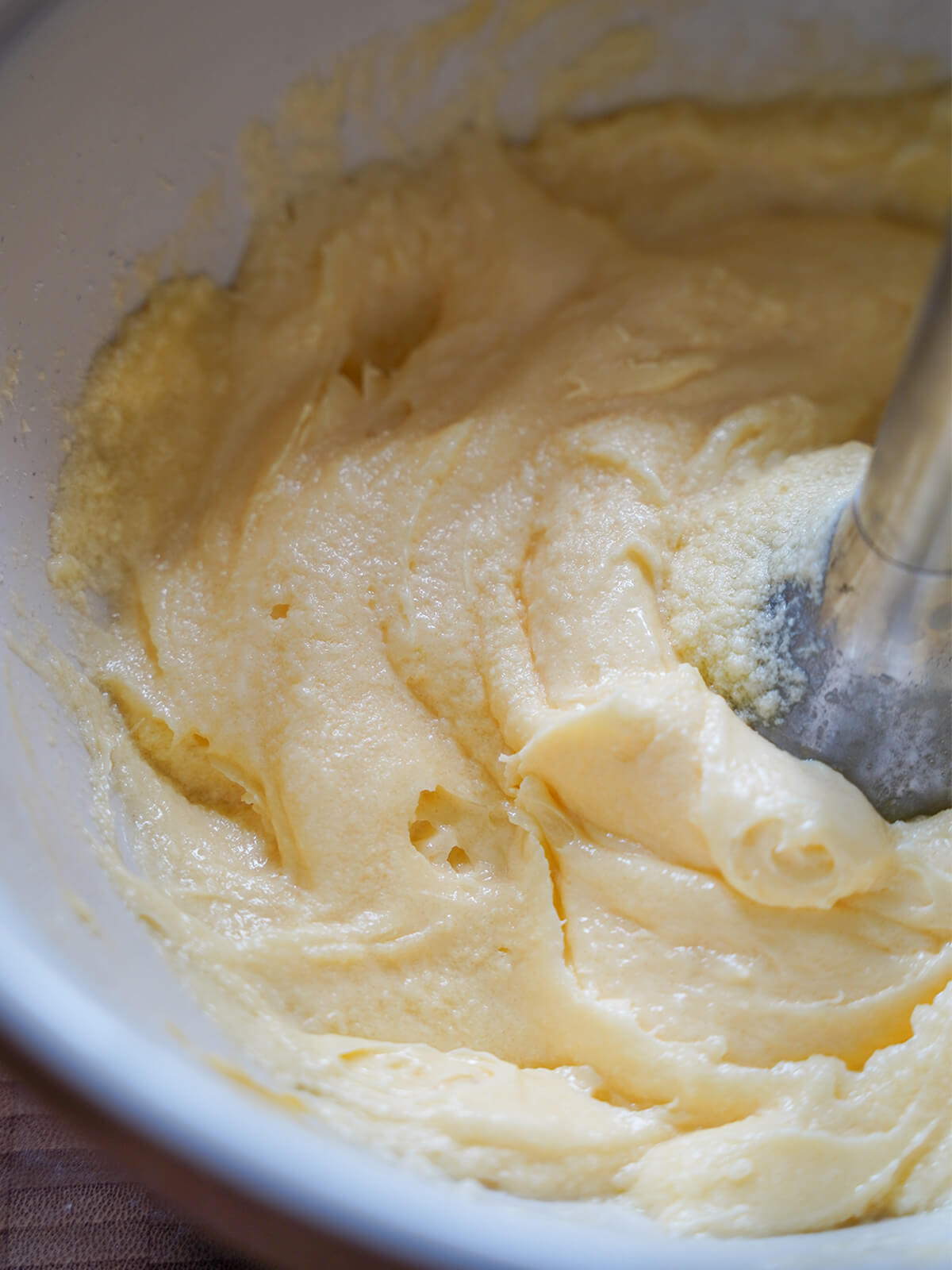 creaming butter, sugar and eggs together in bowl.