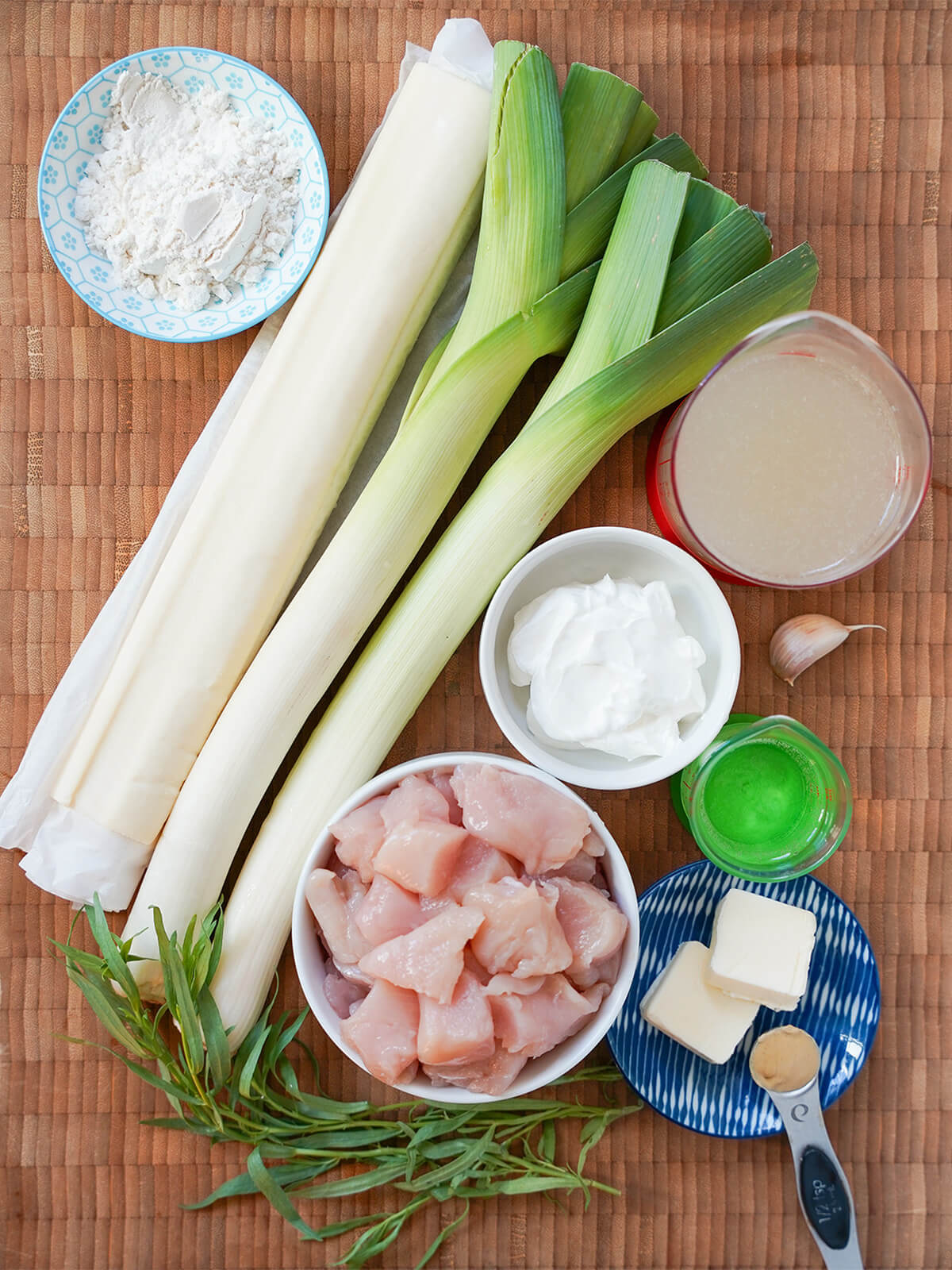 roll of uff pastry, leeks, dishes with chicken, flour, sour cream, stock and butter.